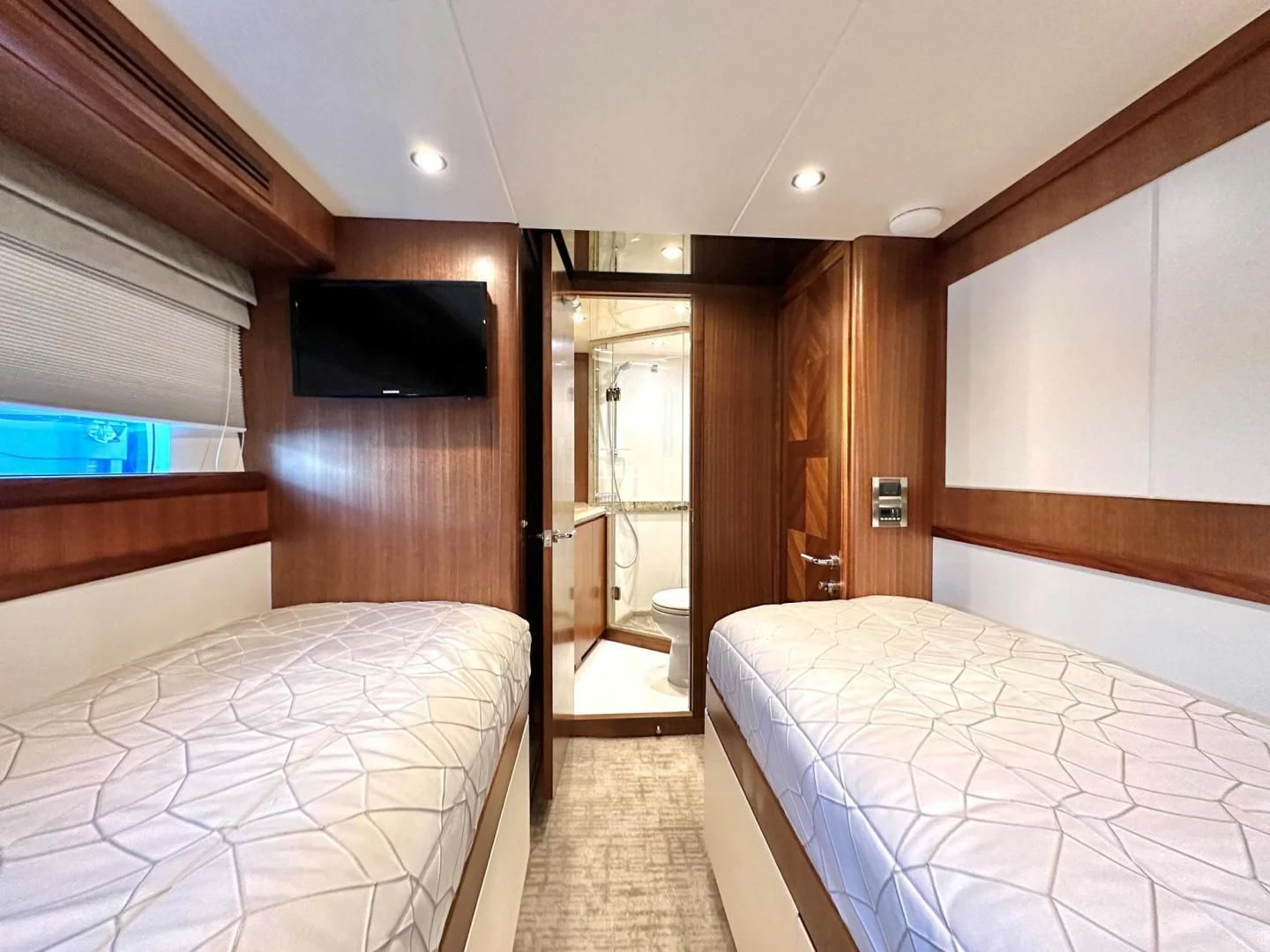 a room with two beds aboard CRUMDALE Yacht for Sale