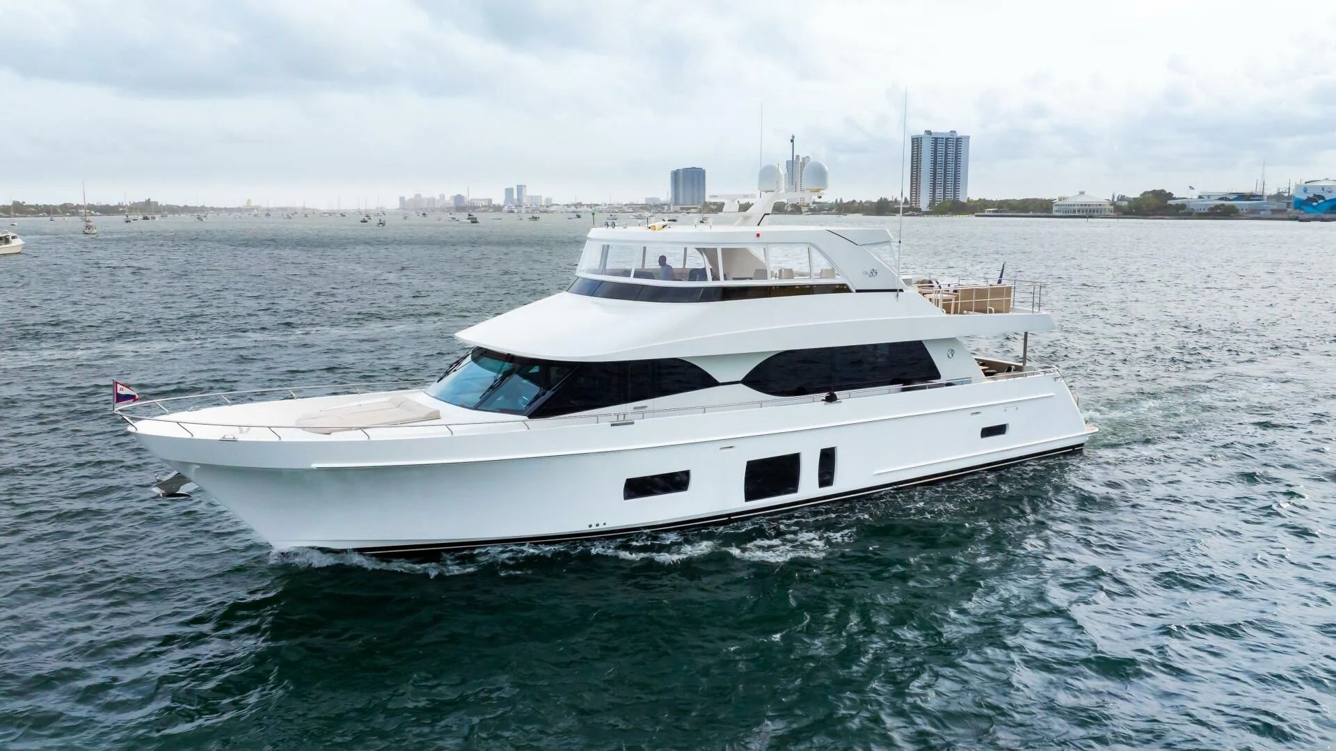 a white yacht in the water aboard CRUMDALE Yacht for Sale