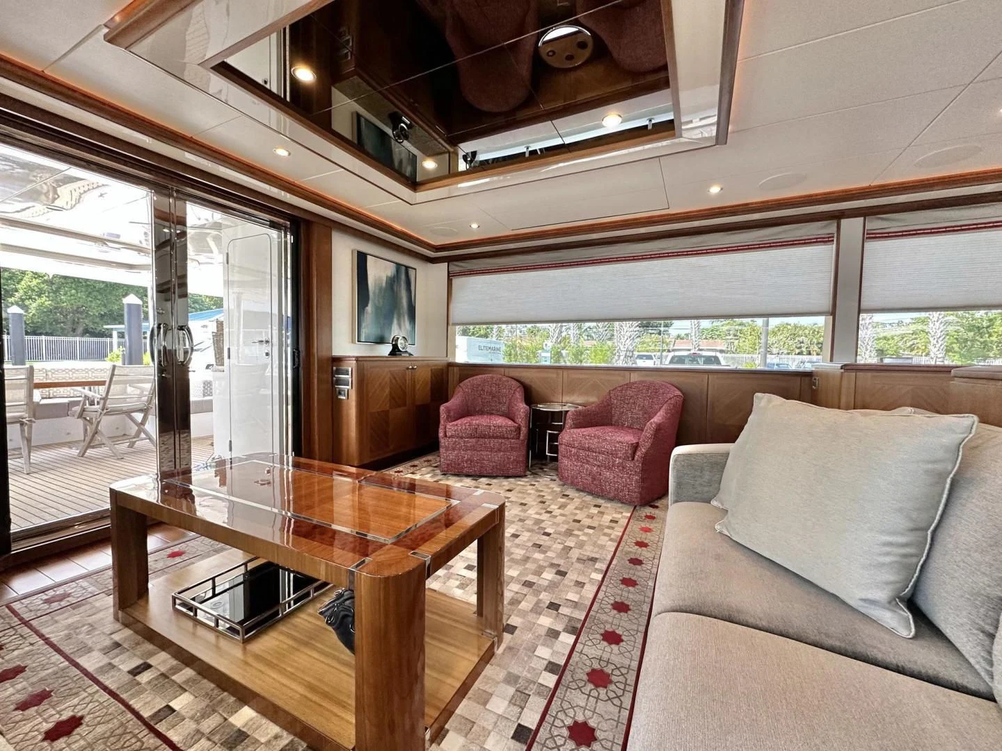 a living room with a table and chairs aboard CRUMDALE Yacht for Sale