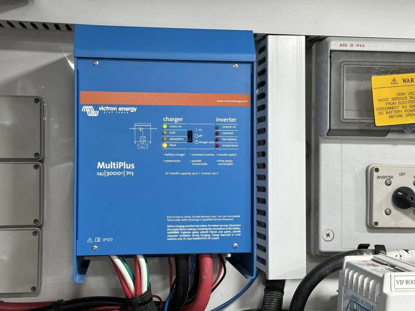 a blue rectangular electronic device aboard CRUMDALE Yacht for Sale