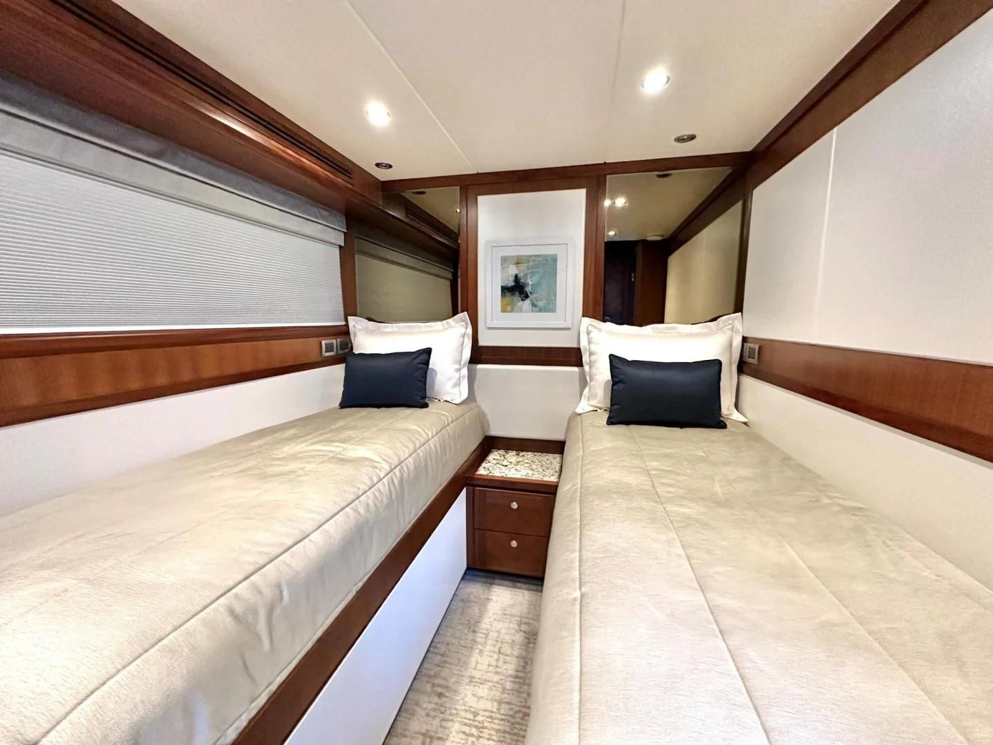 a room with two beds aboard CRUMDALE Yacht for Sale