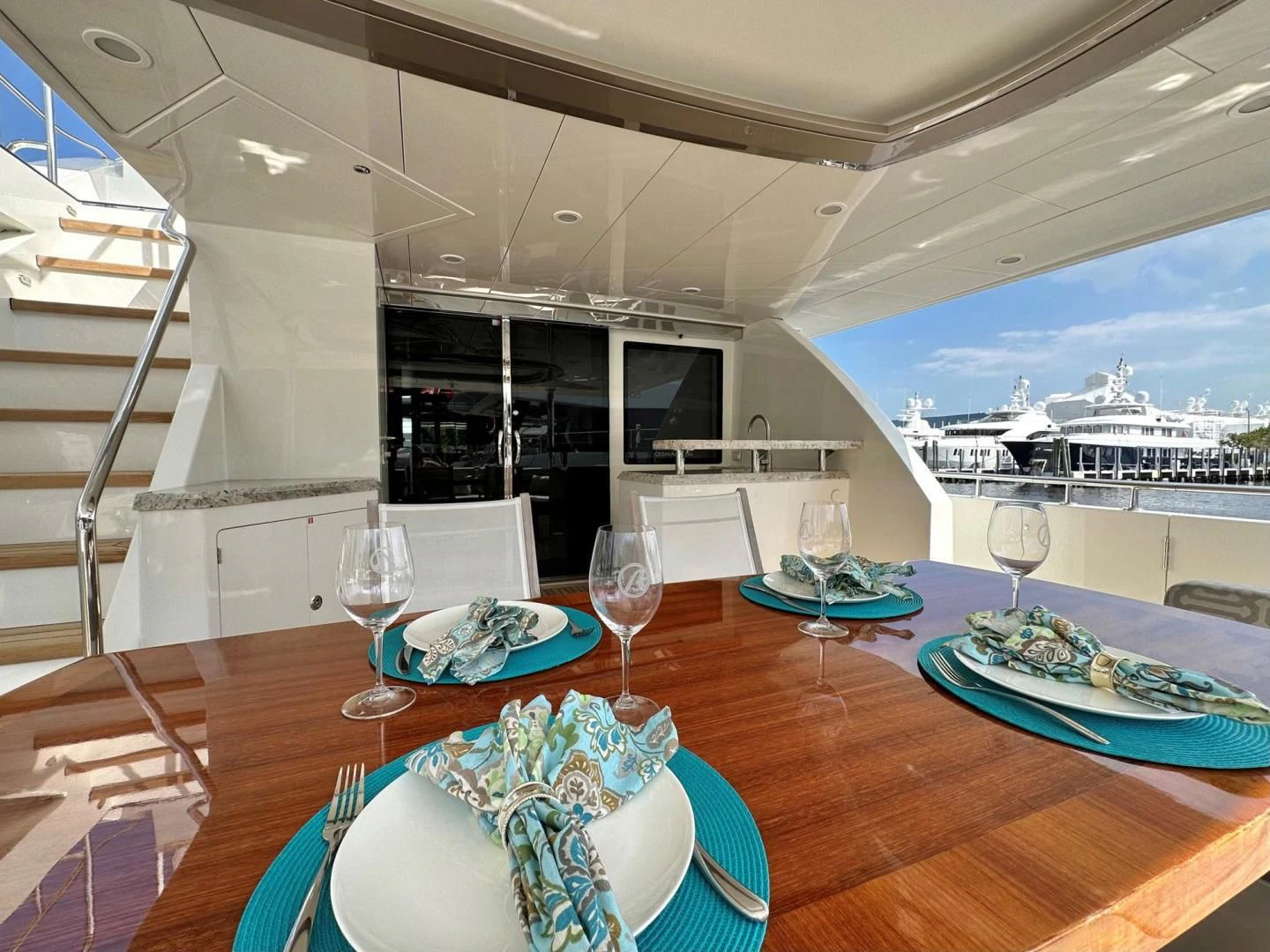 a table with plates and glasses on it aboard CRUMDALE Yacht for Sale