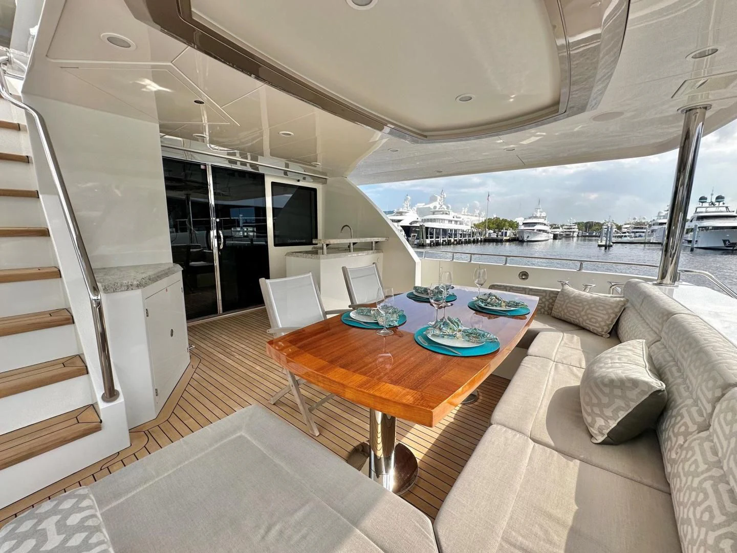 a living room with a large balcony aboard CRUMDALE Yacht for Sale