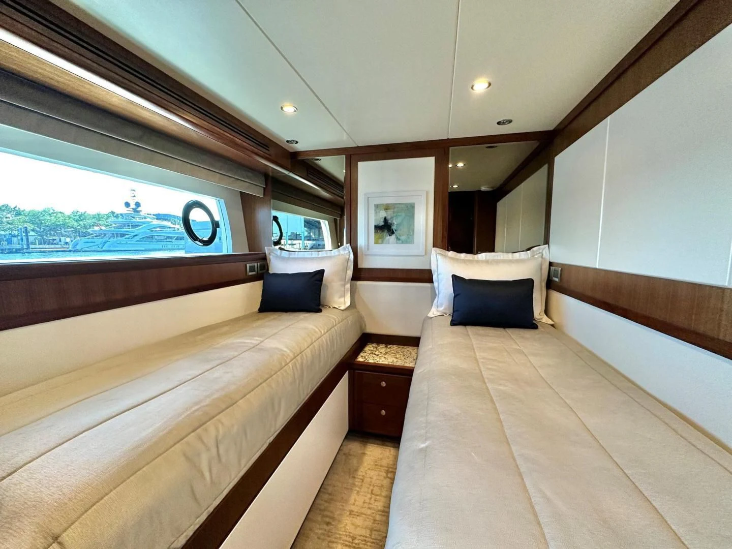 a room with a bed and a window aboard CRUMDALE Yacht for Sale