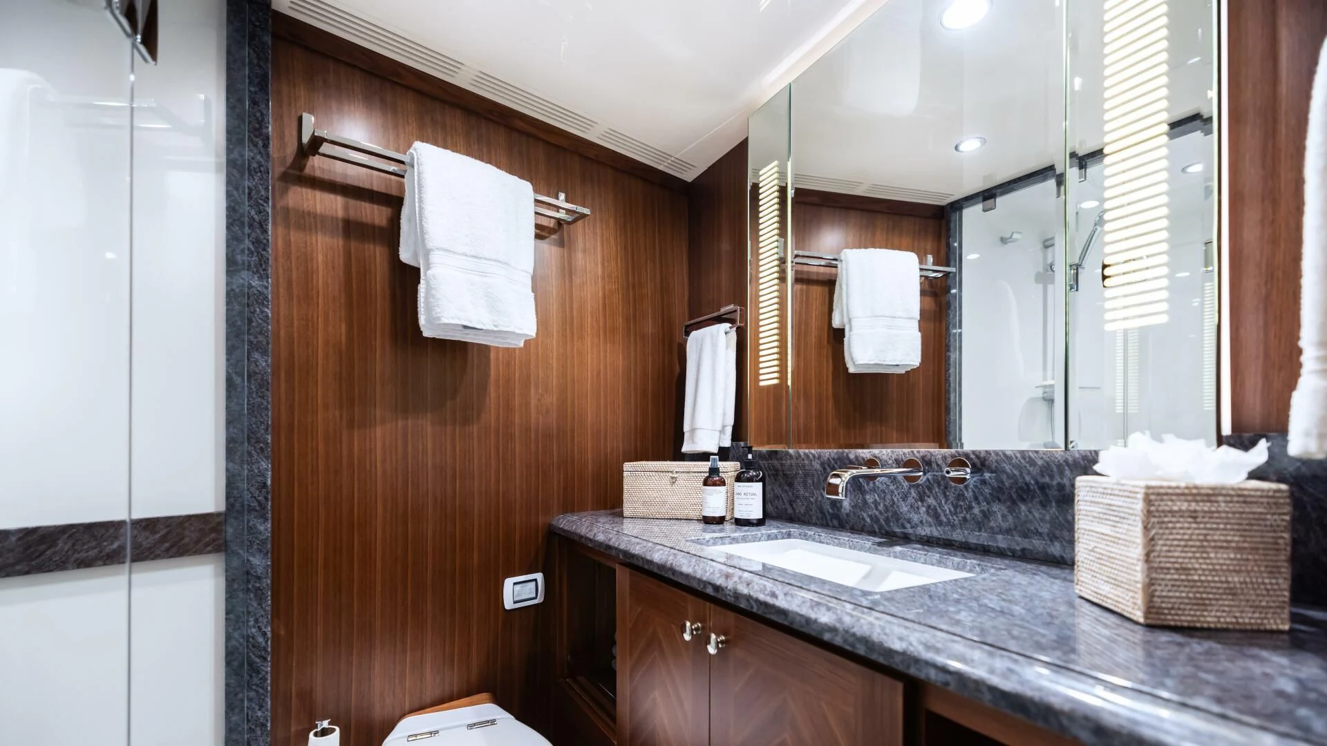 a bathroom with a sink and a mirror aboard CRUMDALE Yacht for Sale