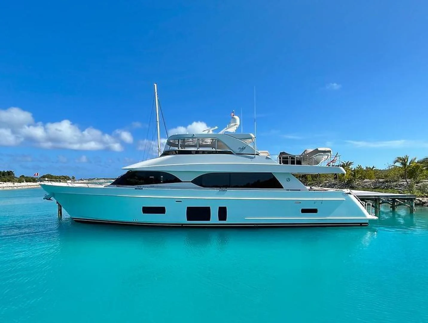 a white yacht on the water aboard CRUMDALE Yacht for Sale