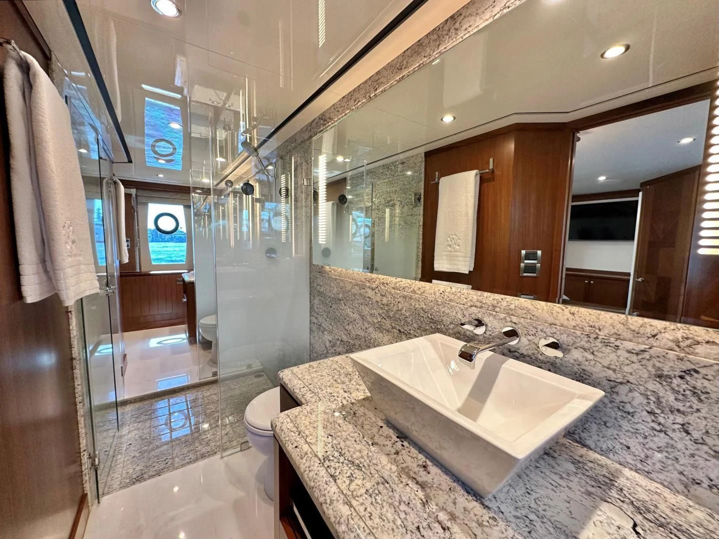 a bathroom with a marble countertop aboard CRUMDALE Yacht for Sale