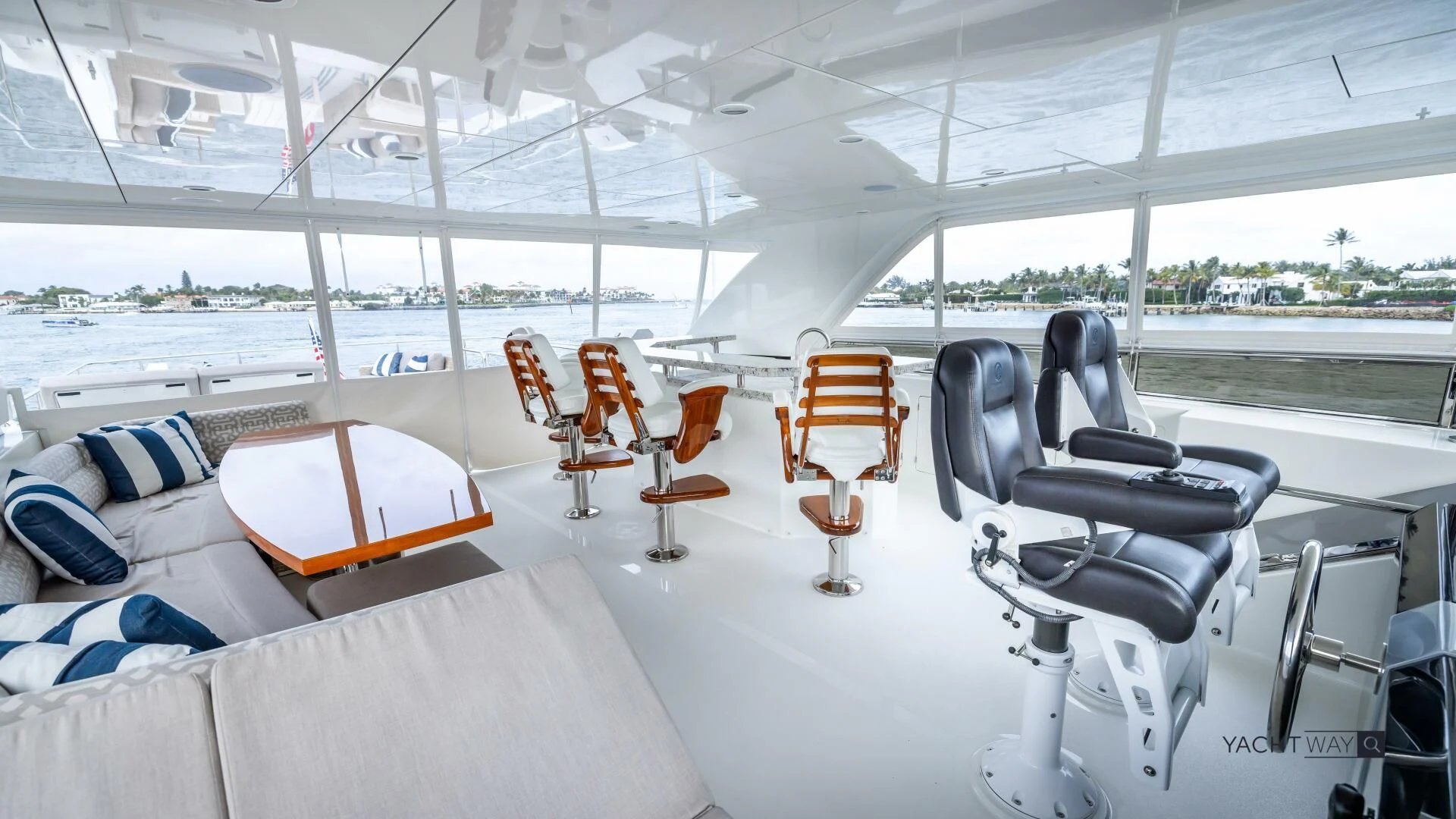 a large white tent with chairs and tables on it aboard CRUMDALE Yacht for Sale