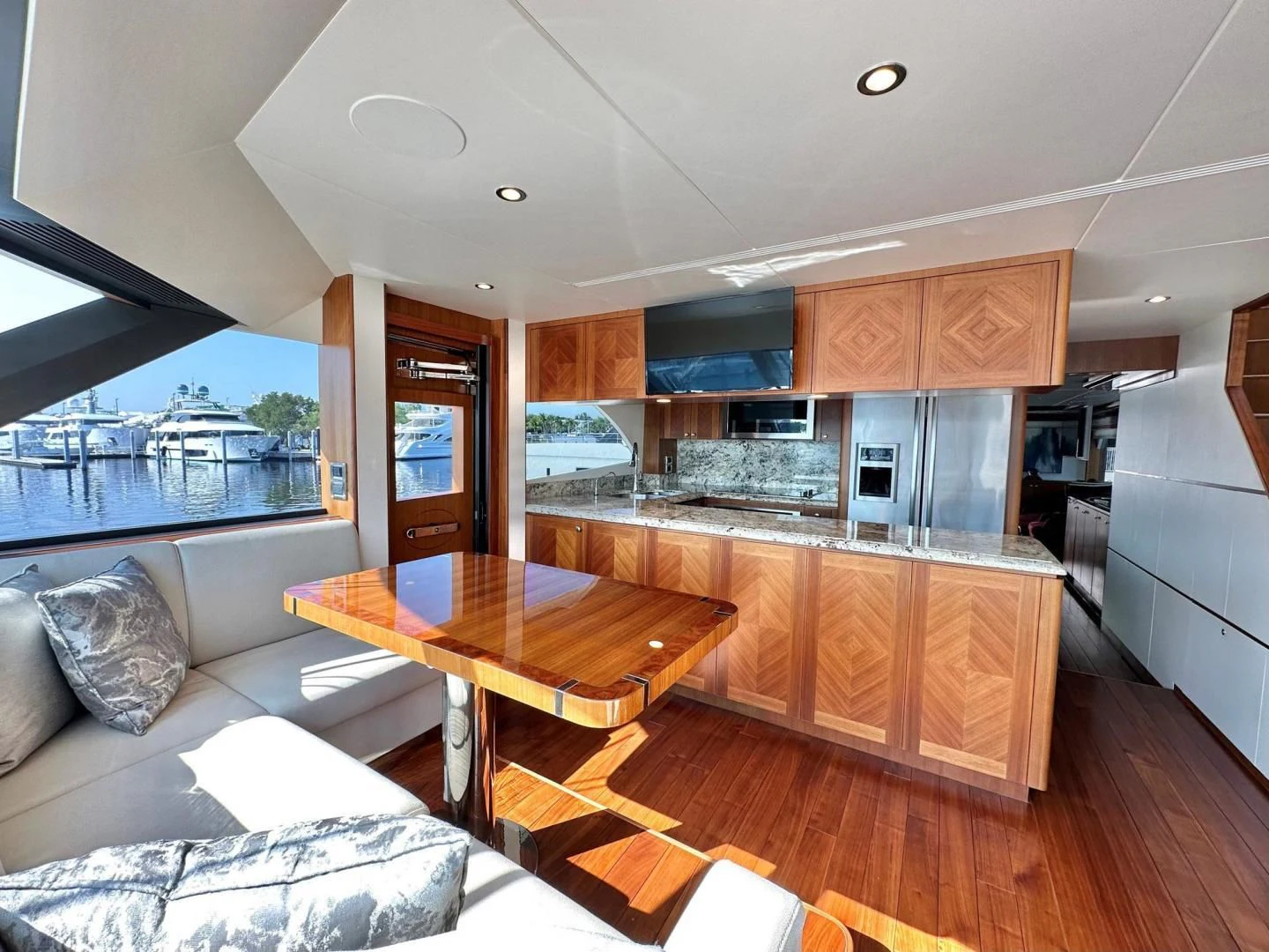 a kitchen with a table and a couch aboard CRUMDALE Yacht for Sale