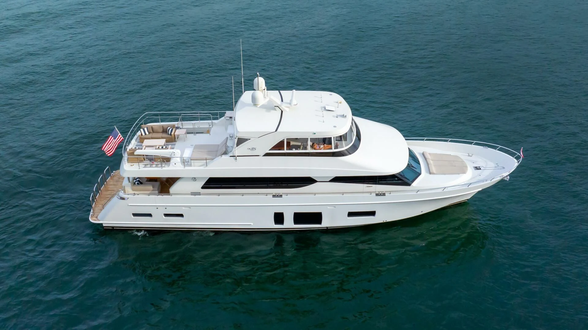 a white boat in the water aboard CRUMDALE Yacht for Sale