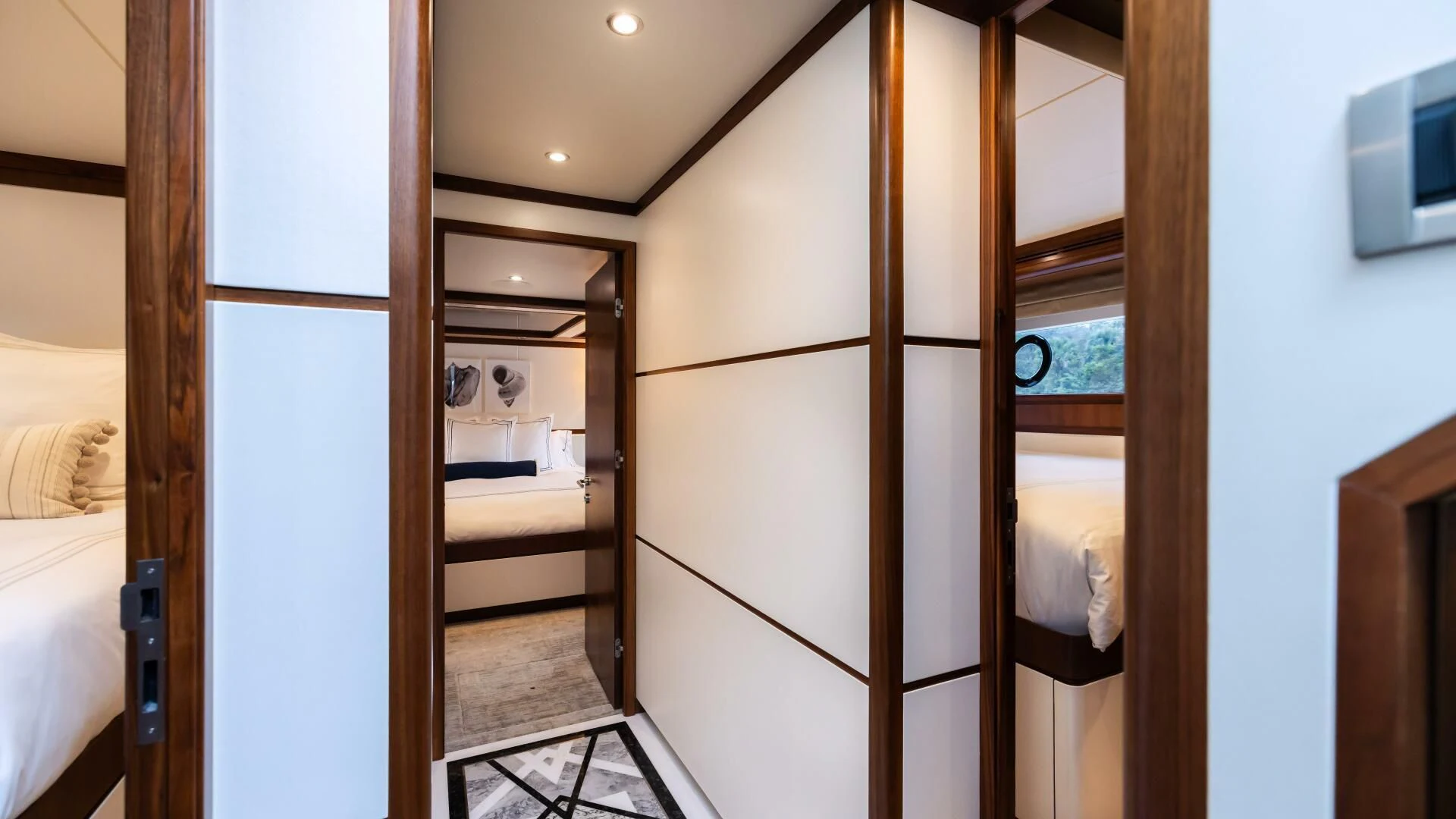 a room with a bed and a closet aboard CRUMDALE Yacht for Sale