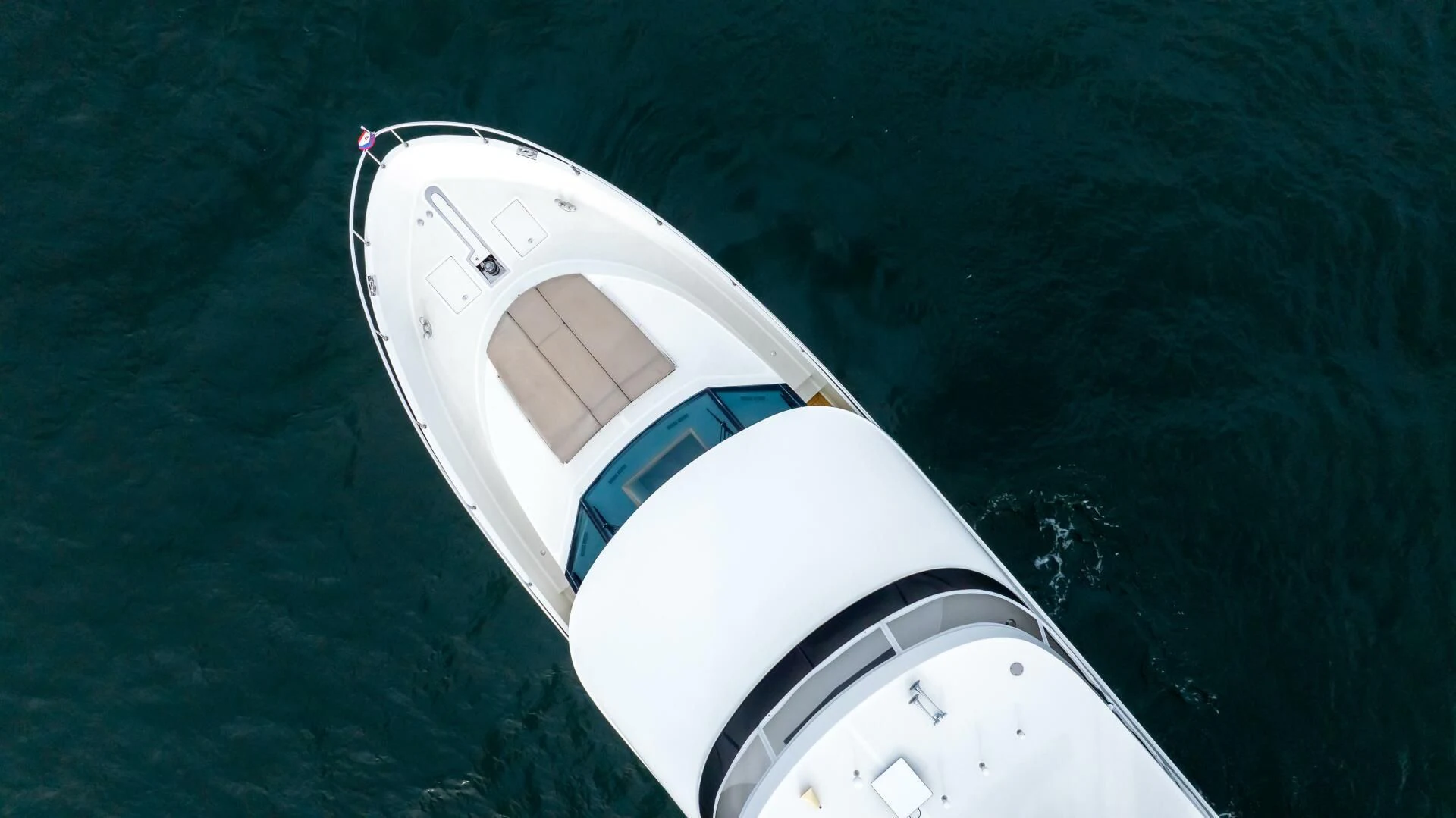 a white space ship in the water aboard CRUMDALE Yacht for Sale