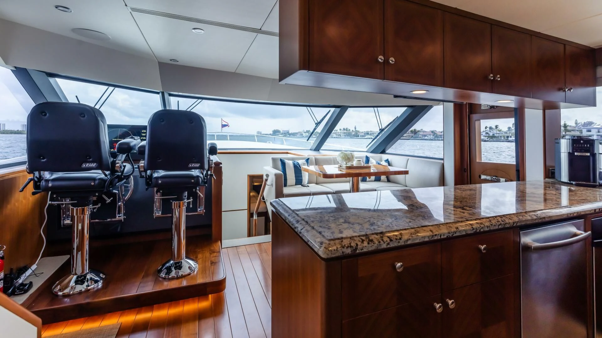 a room with a table and chairs aboard CRUMDALE Yacht for Sale