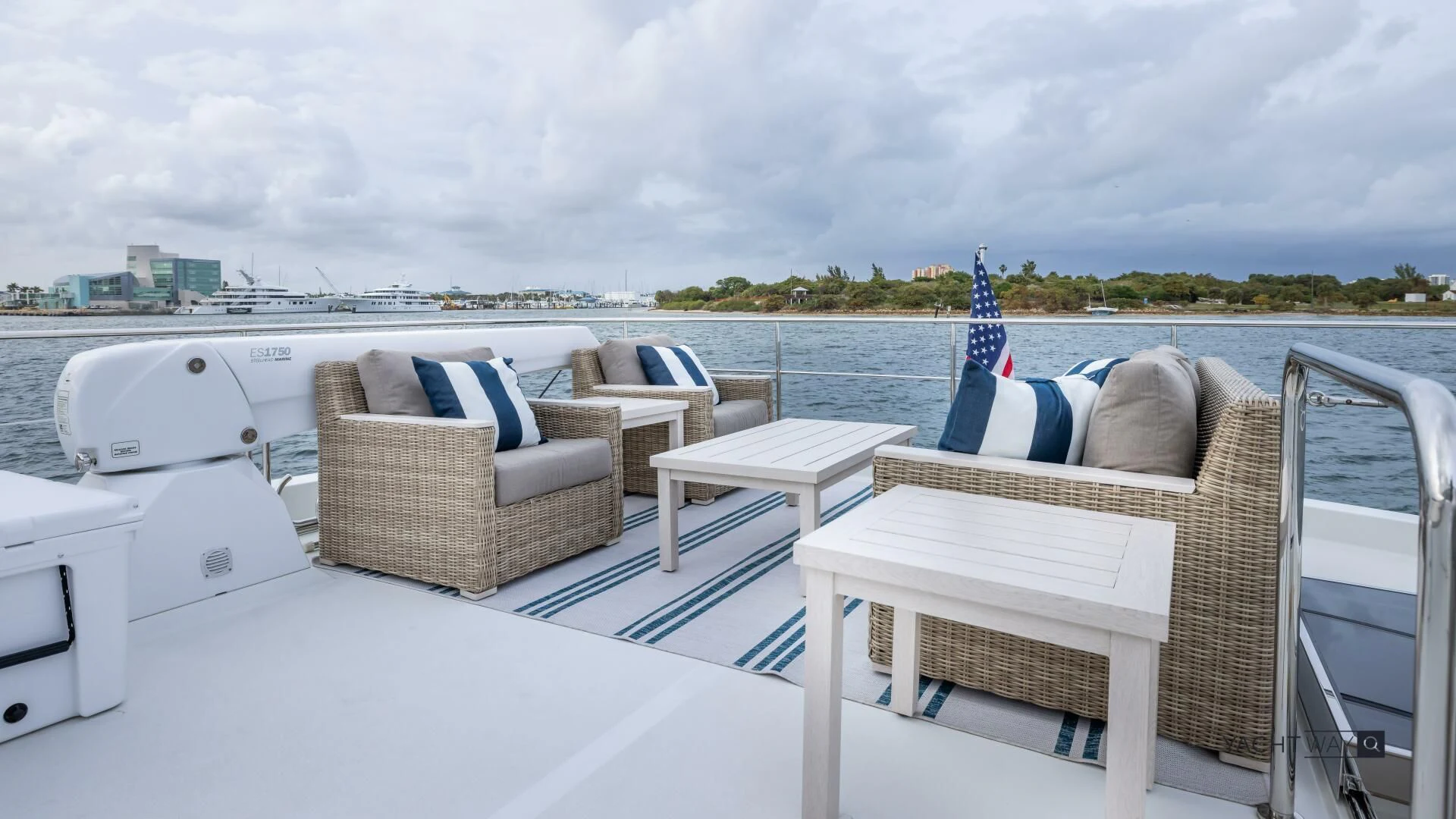 a deck with chairs and a view of the city aboard CRUMDALE Yacht for Sale