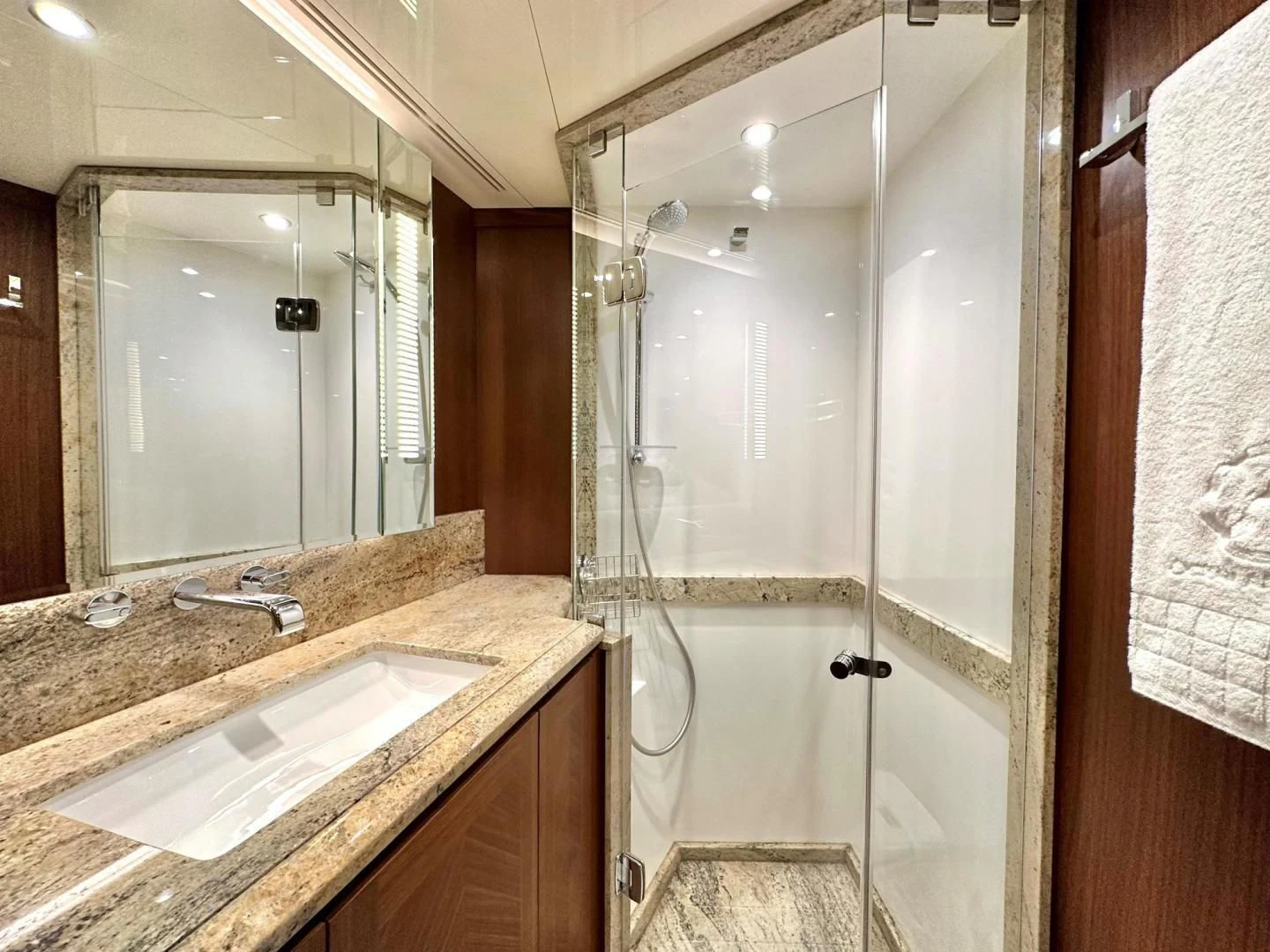 a bathroom with a glass shower aboard CRUMDALE Yacht for Sale