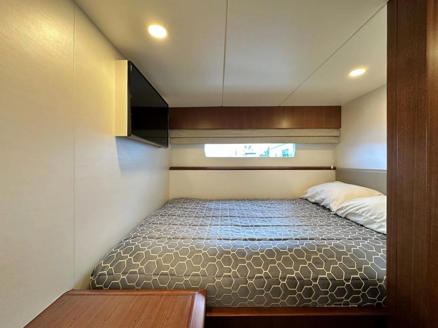 a bed in a room aboard CRUMDALE Yacht for Sale