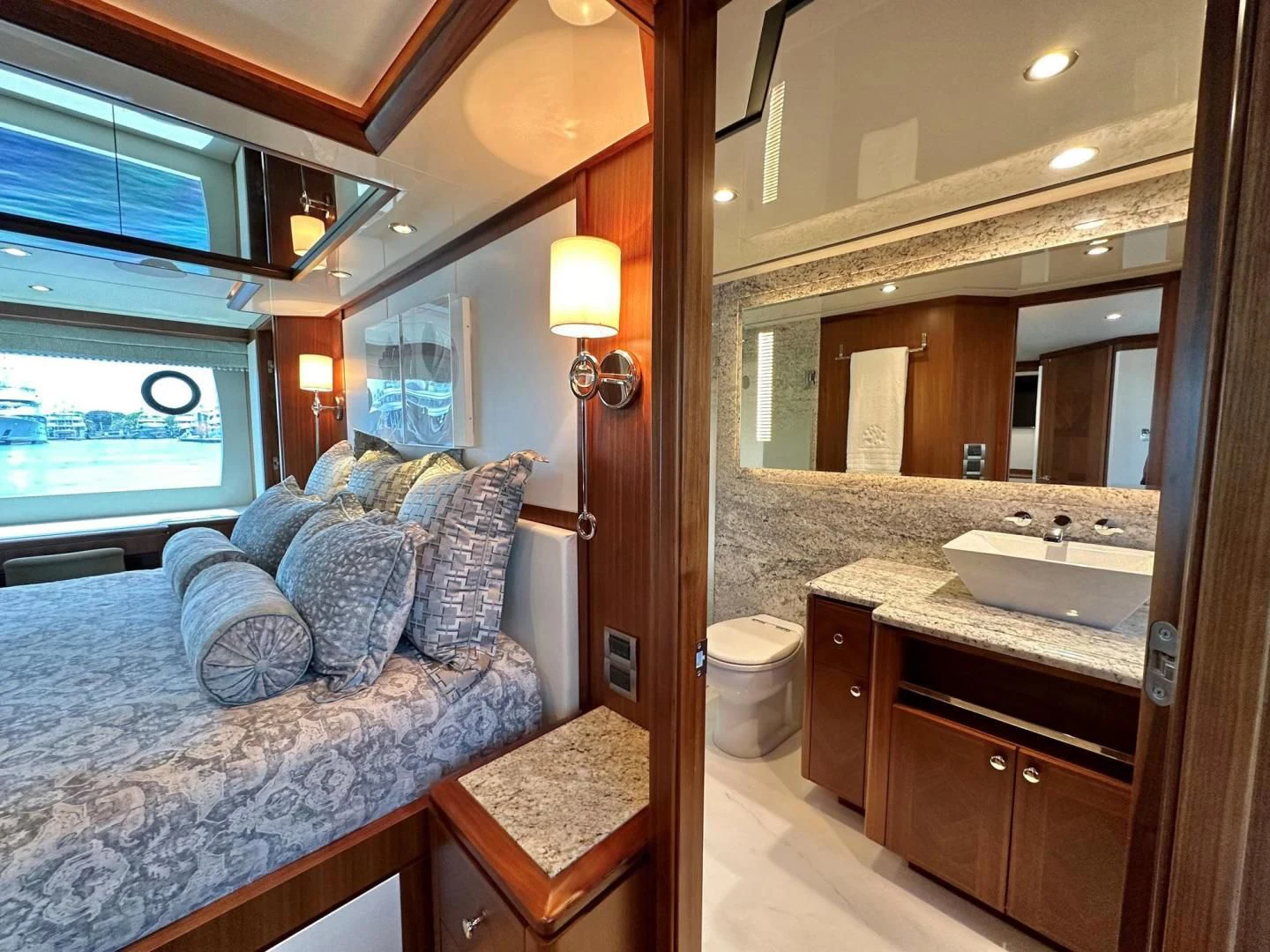 a bathroom with a bed and a sink aboard CRUMDALE Yacht for Sale