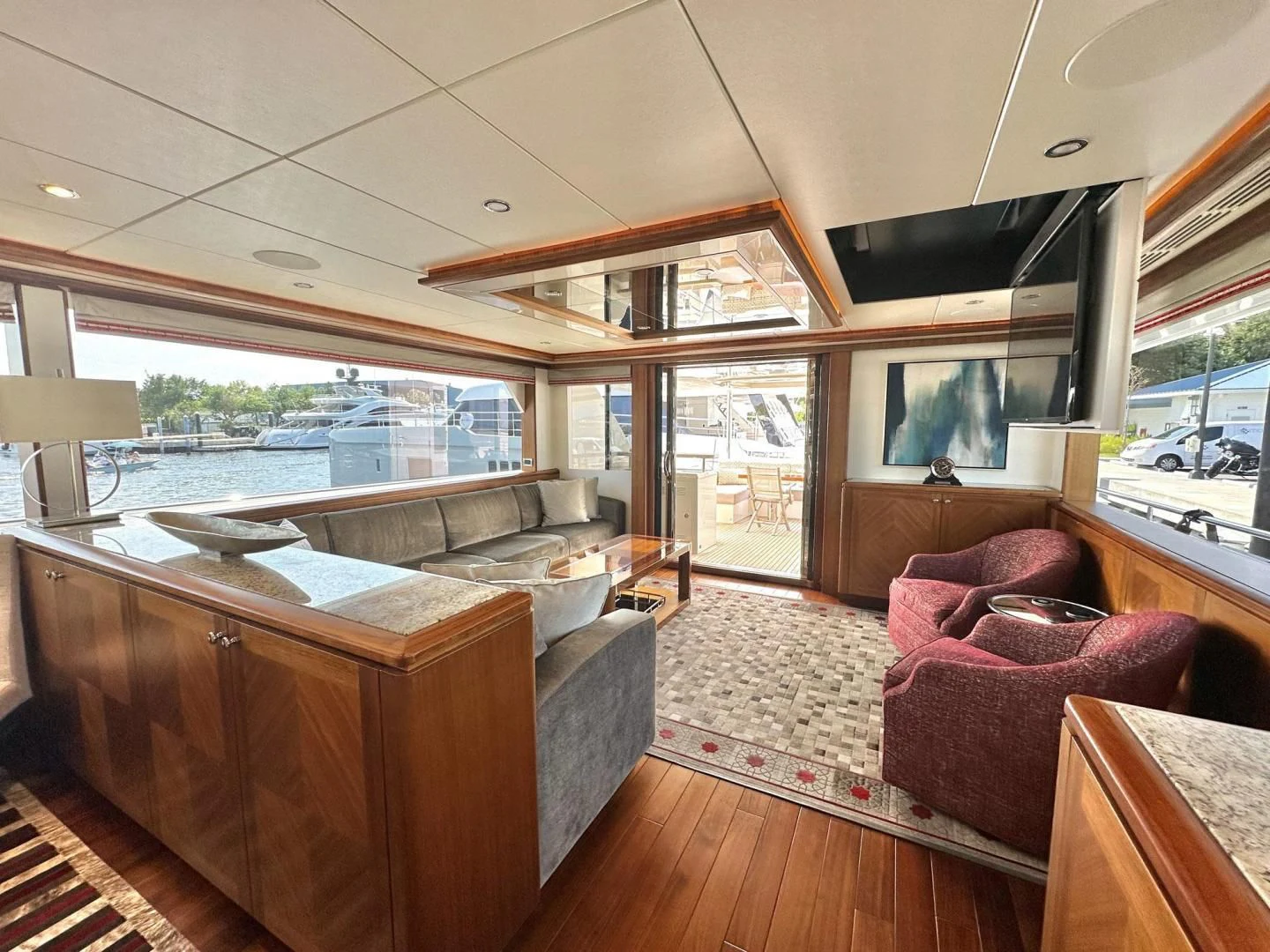 a living room with a large window aboard CRUMDALE Yacht for Sale