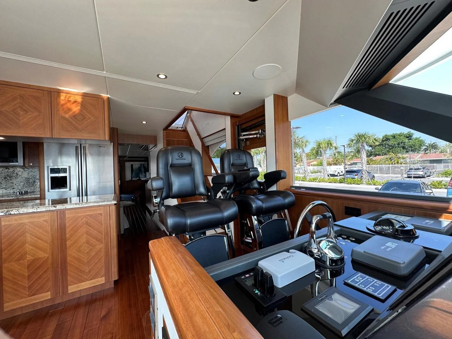 a room with a desk and chairs aboard CRUMDALE Yacht for Sale