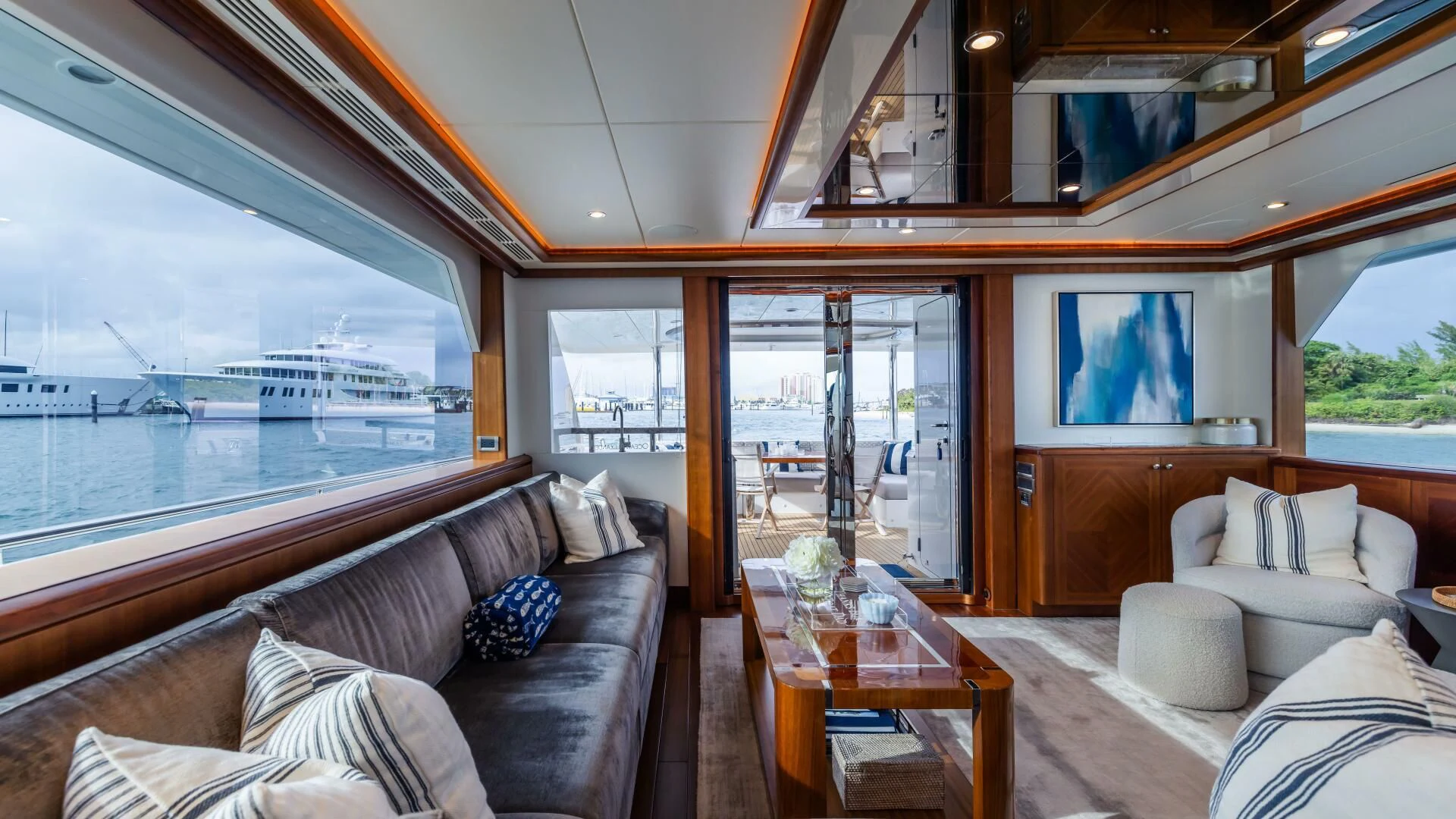 a living room with a large window aboard CRUMDALE Yacht for Sale