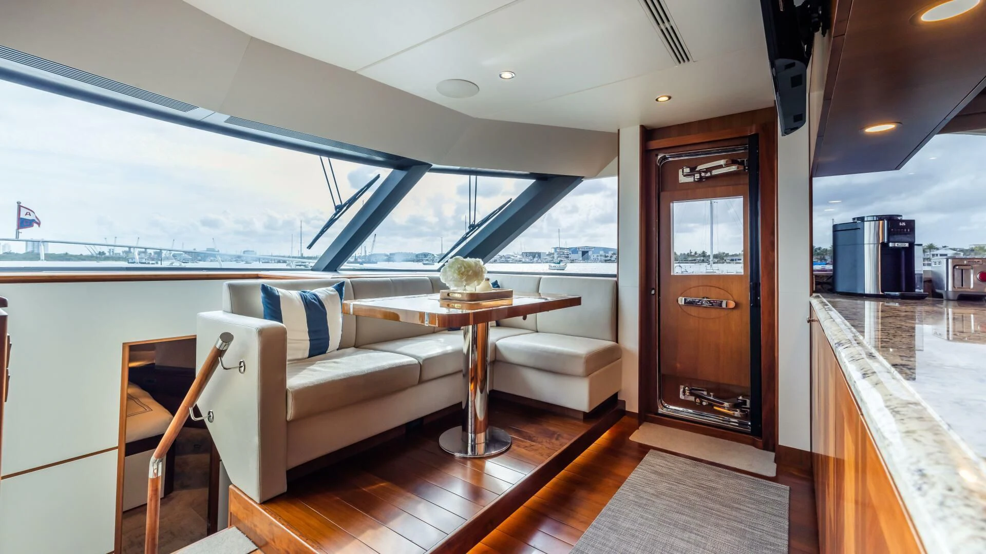 a living room with a large window aboard CRUMDALE Yacht for Sale