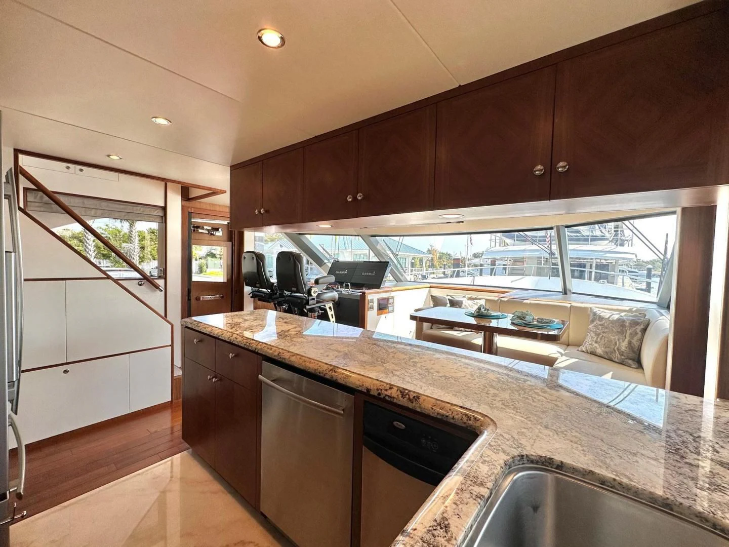 a kitchen with a large island aboard CRUMDALE Yacht for Sale