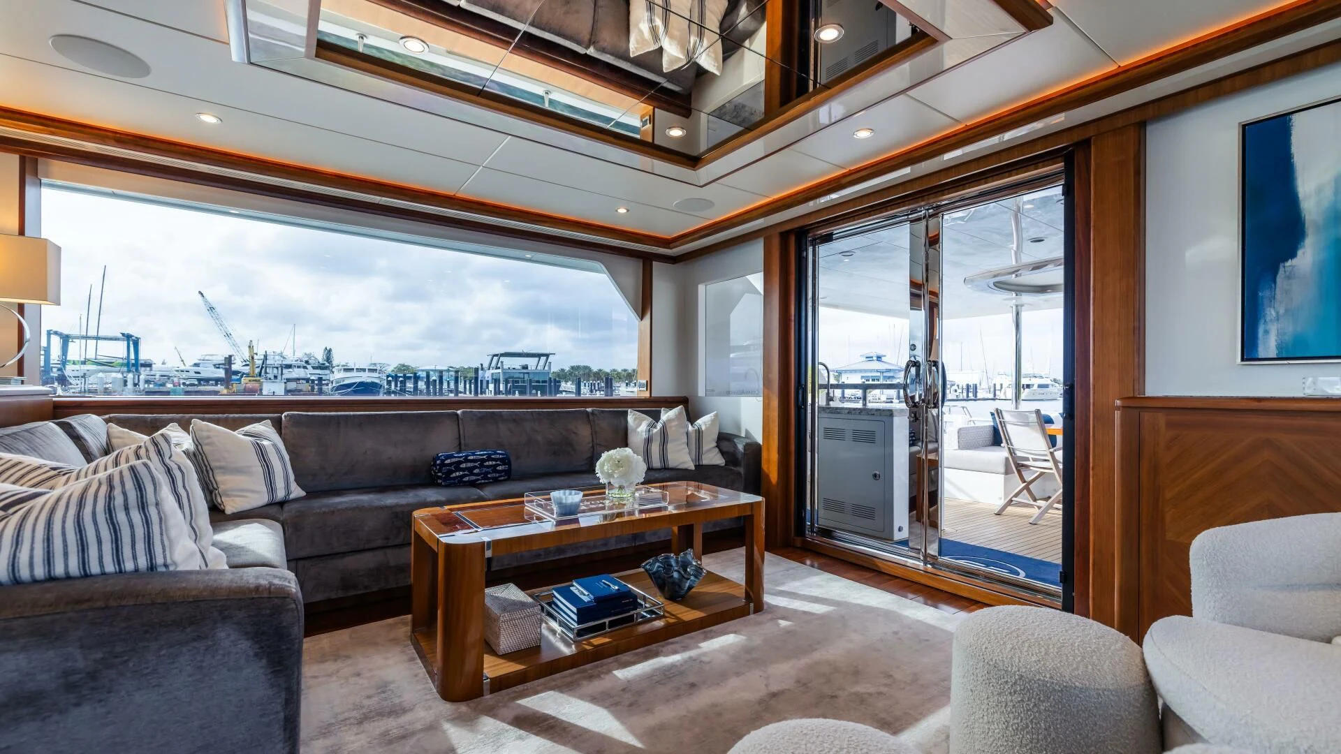 a living room with a large window aboard CRUMDALE Yacht for Sale