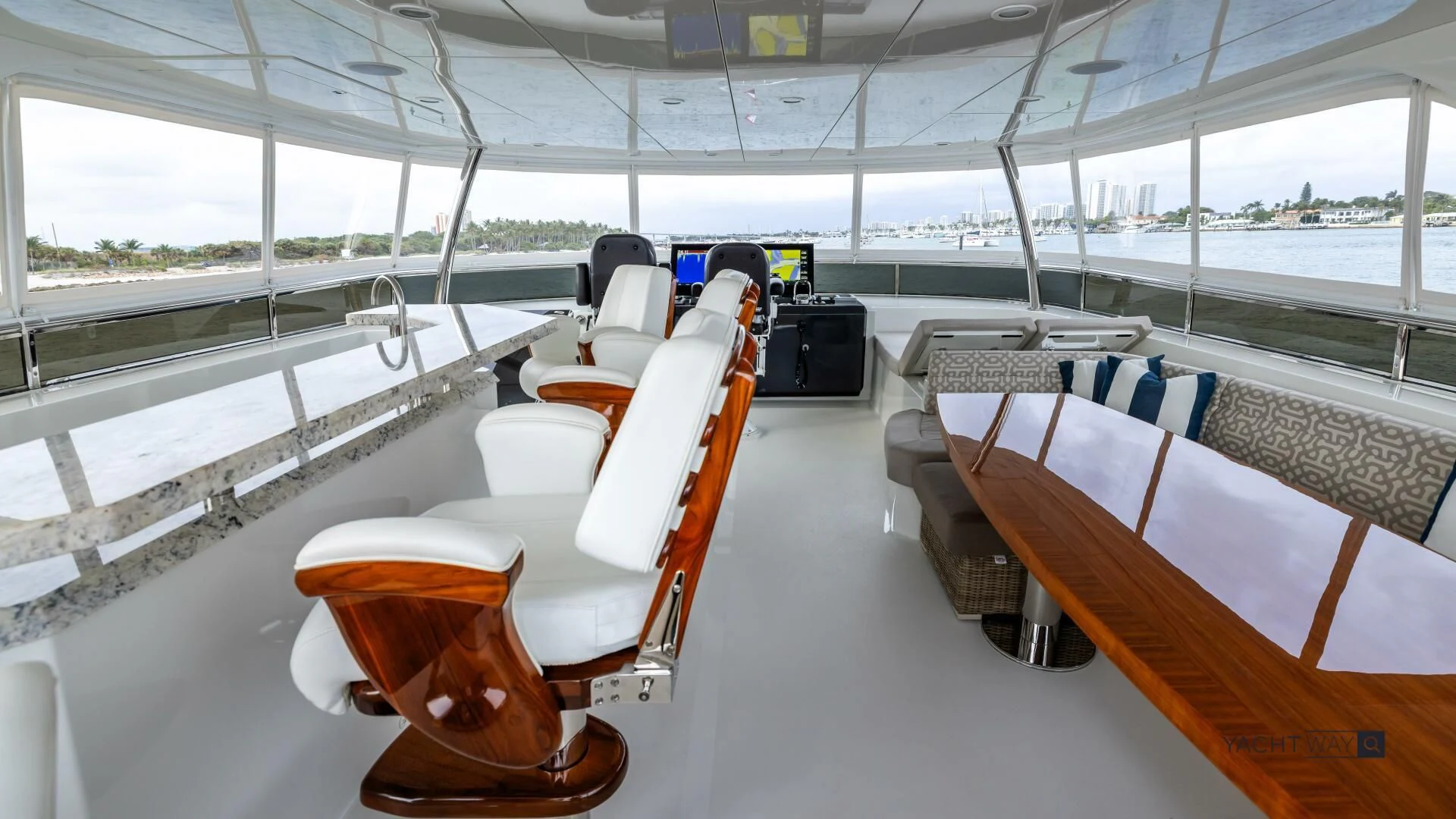 a room with a bed and a chair aboard CRUMDALE Yacht for Sale