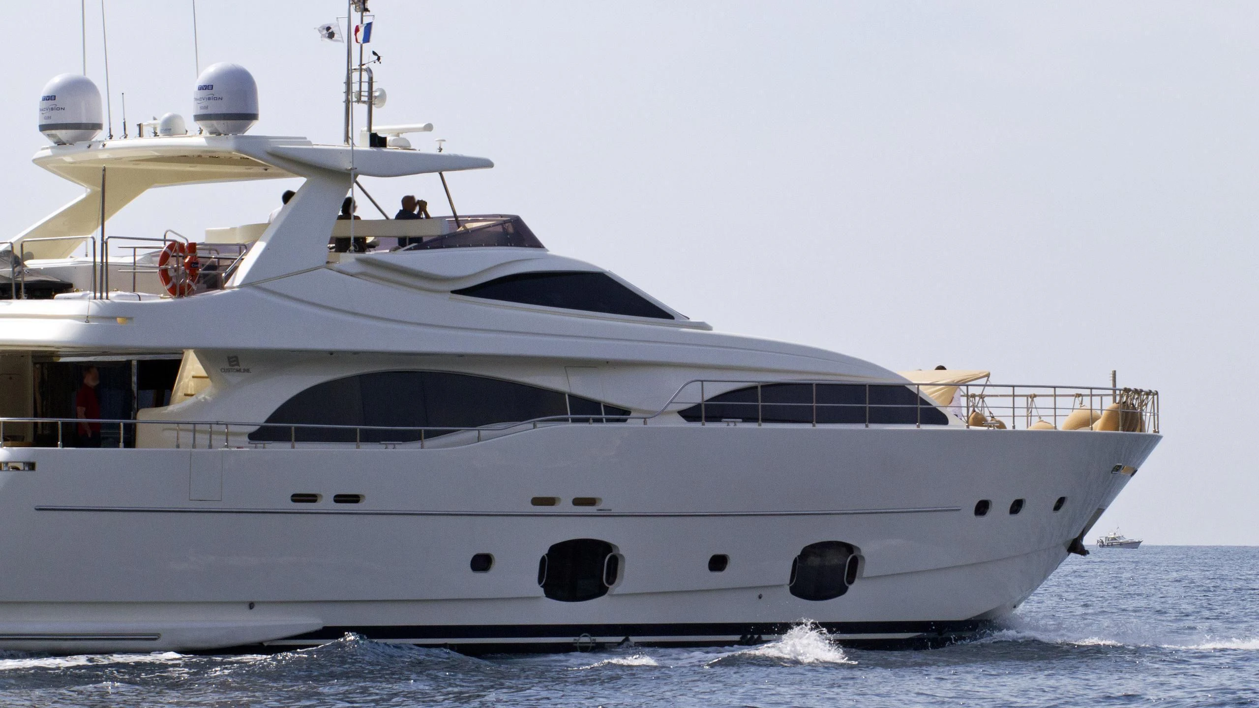 a white yacht on the water aboard PATRON Yacht for Sale
