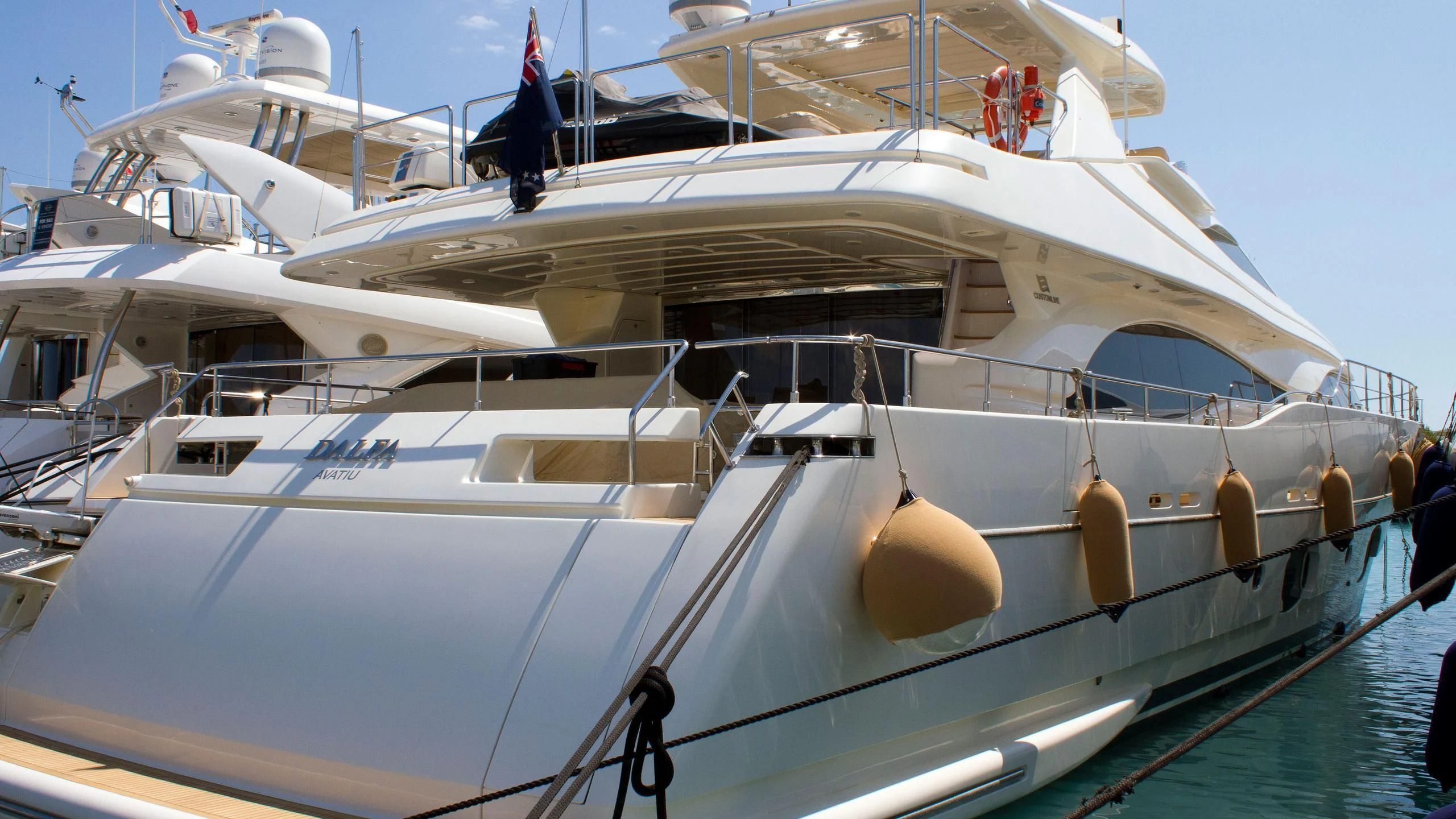 a white boat with a group of people on it aboard PATRON Yacht for Sale