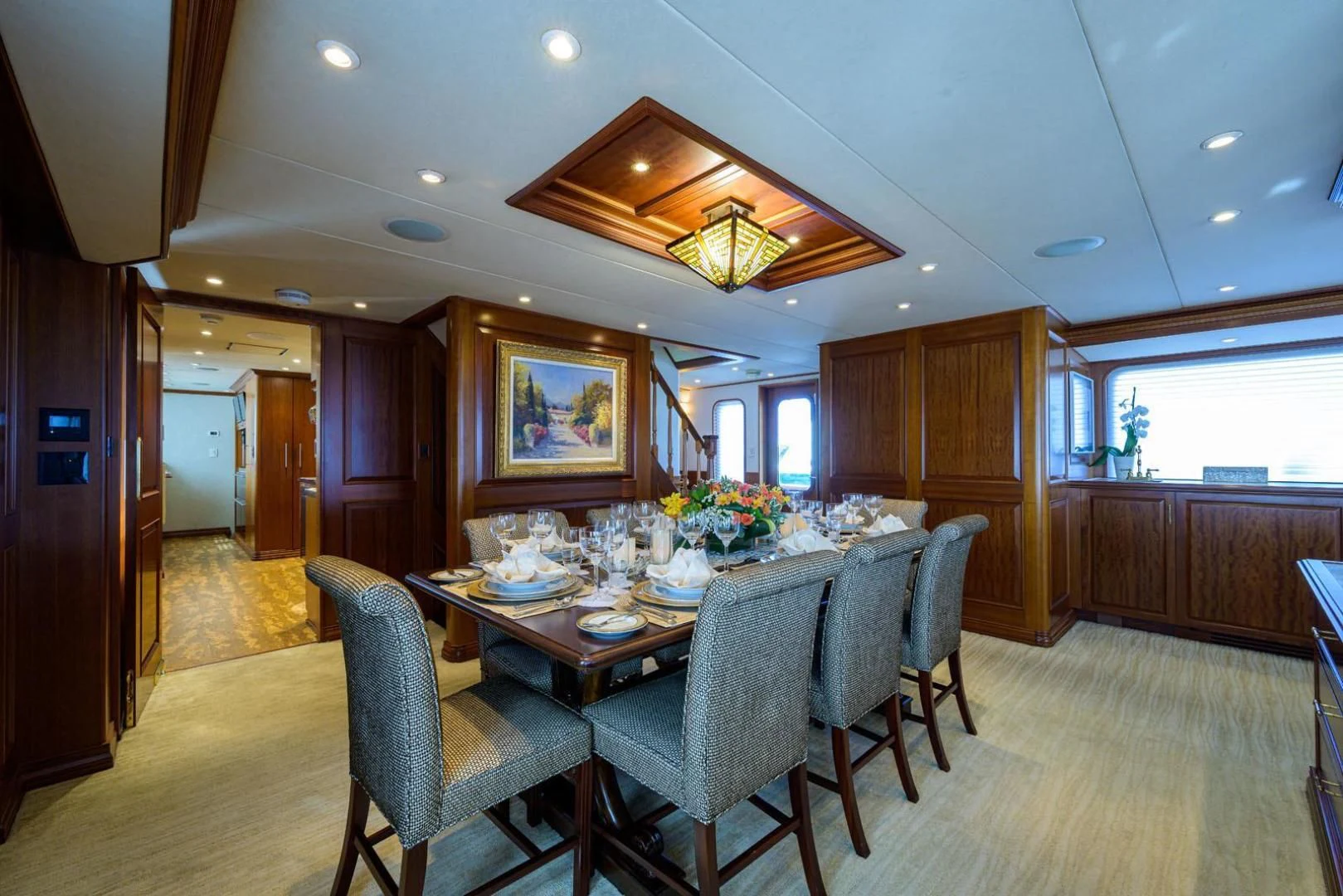 a dining room with a table and chairs aboard LEGACY Yacht for Sale