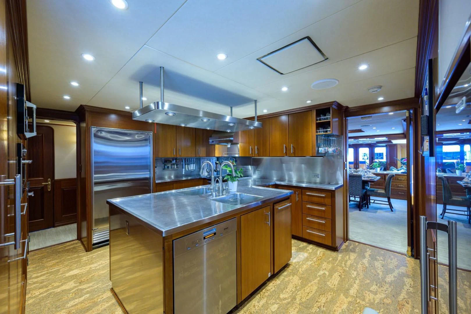a kitchen with a large island aboard LEGACY Yacht for Sale