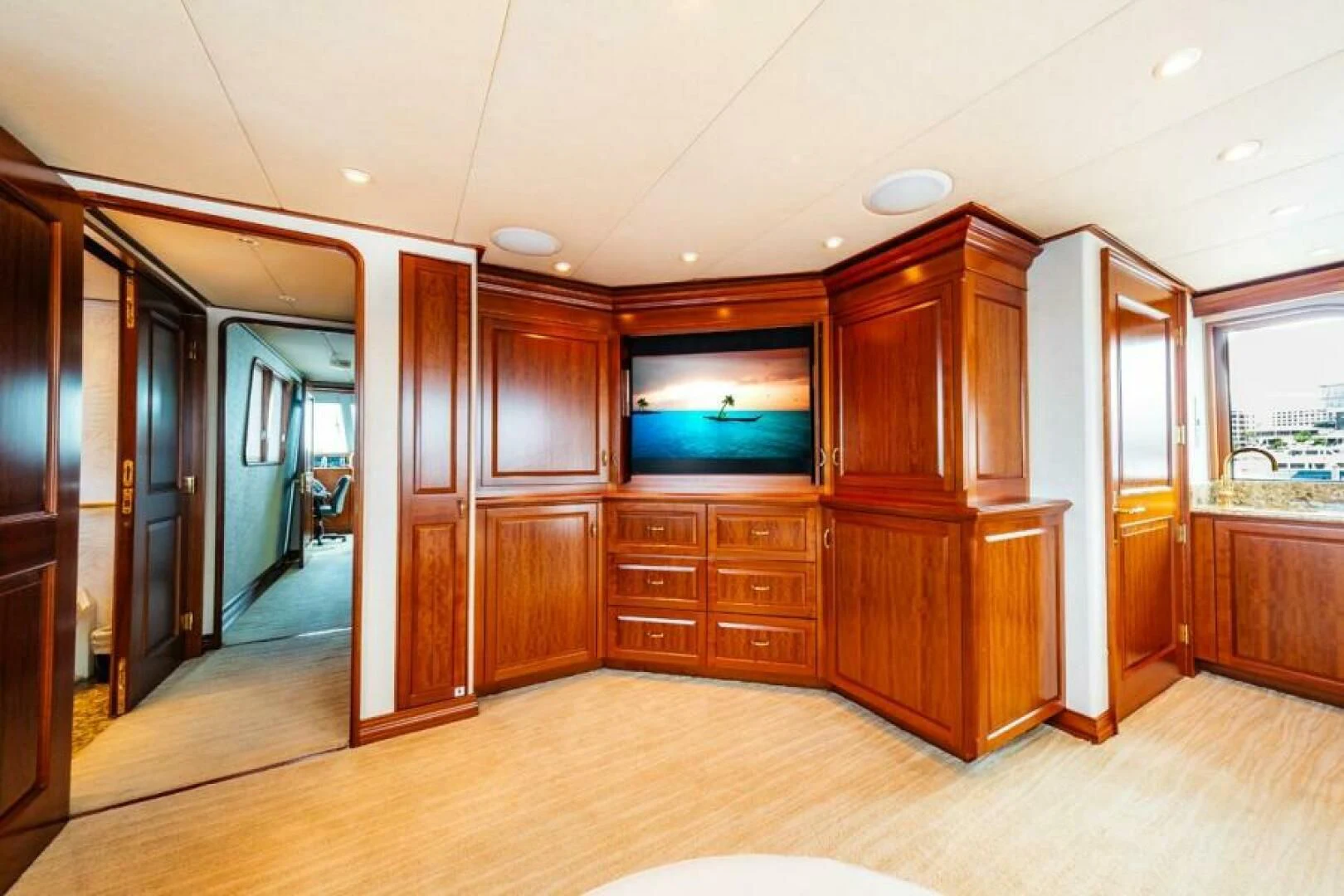 a room with wooden cabinets aboard LEGACY Yacht for Sale