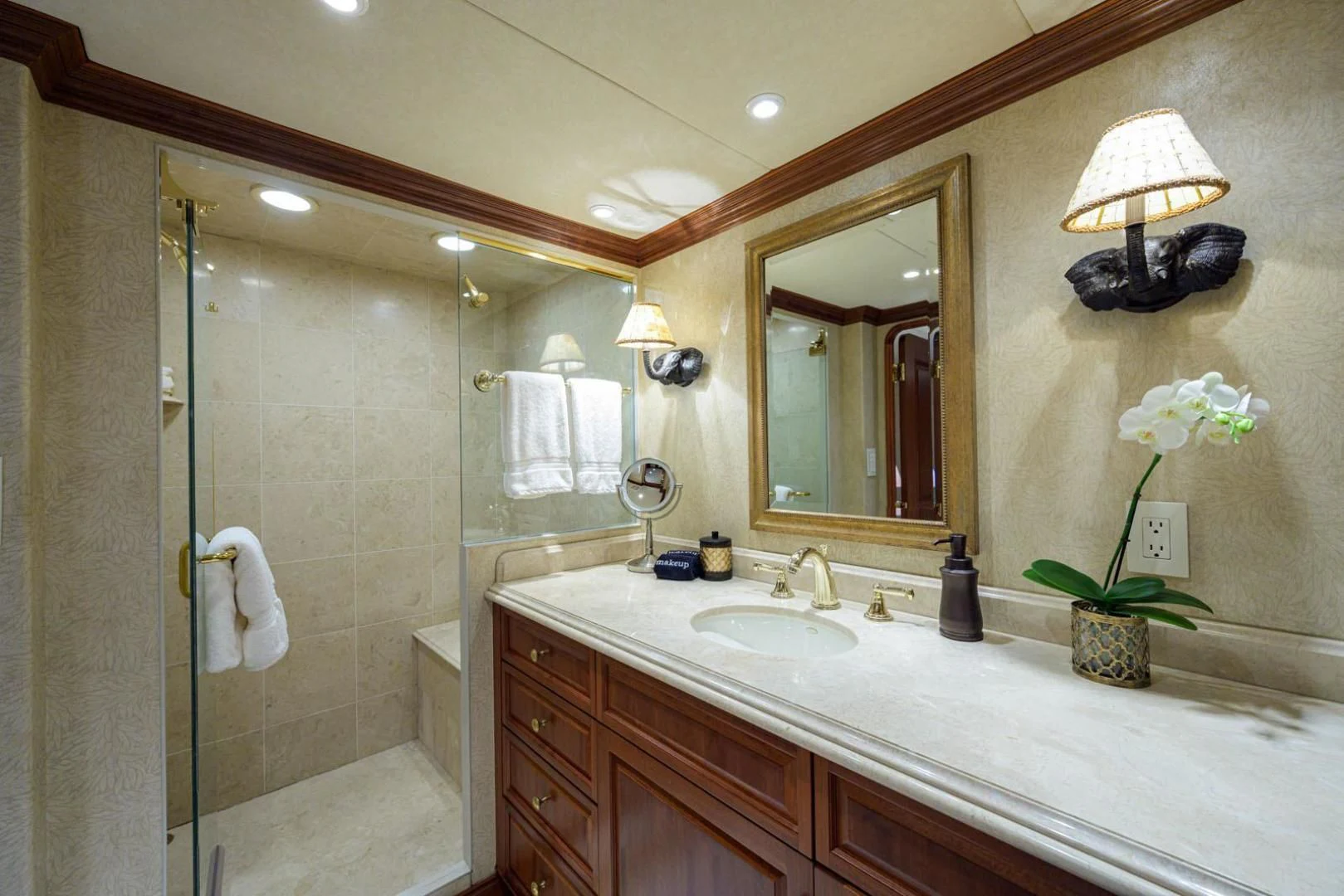 a bathroom with a shower and sink aboard LEGACY Yacht for Sale