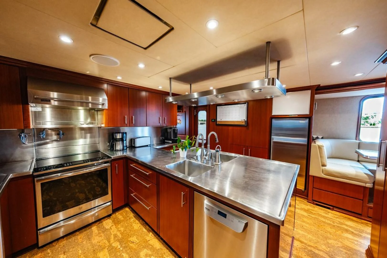 a kitchen with a stove and a sink aboard LEGACY Yacht for Sale