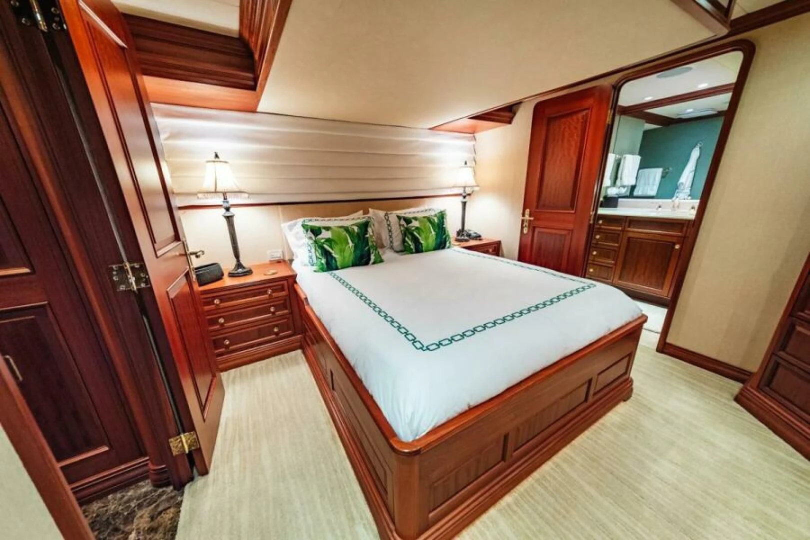 a bedroom with a bed and a desk aboard LEGACY Yacht for Sale