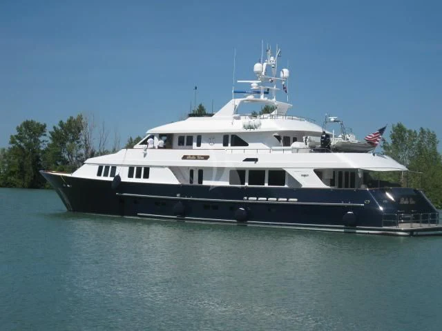 a large boat on the water aboard LEGACY Yacht for Sale