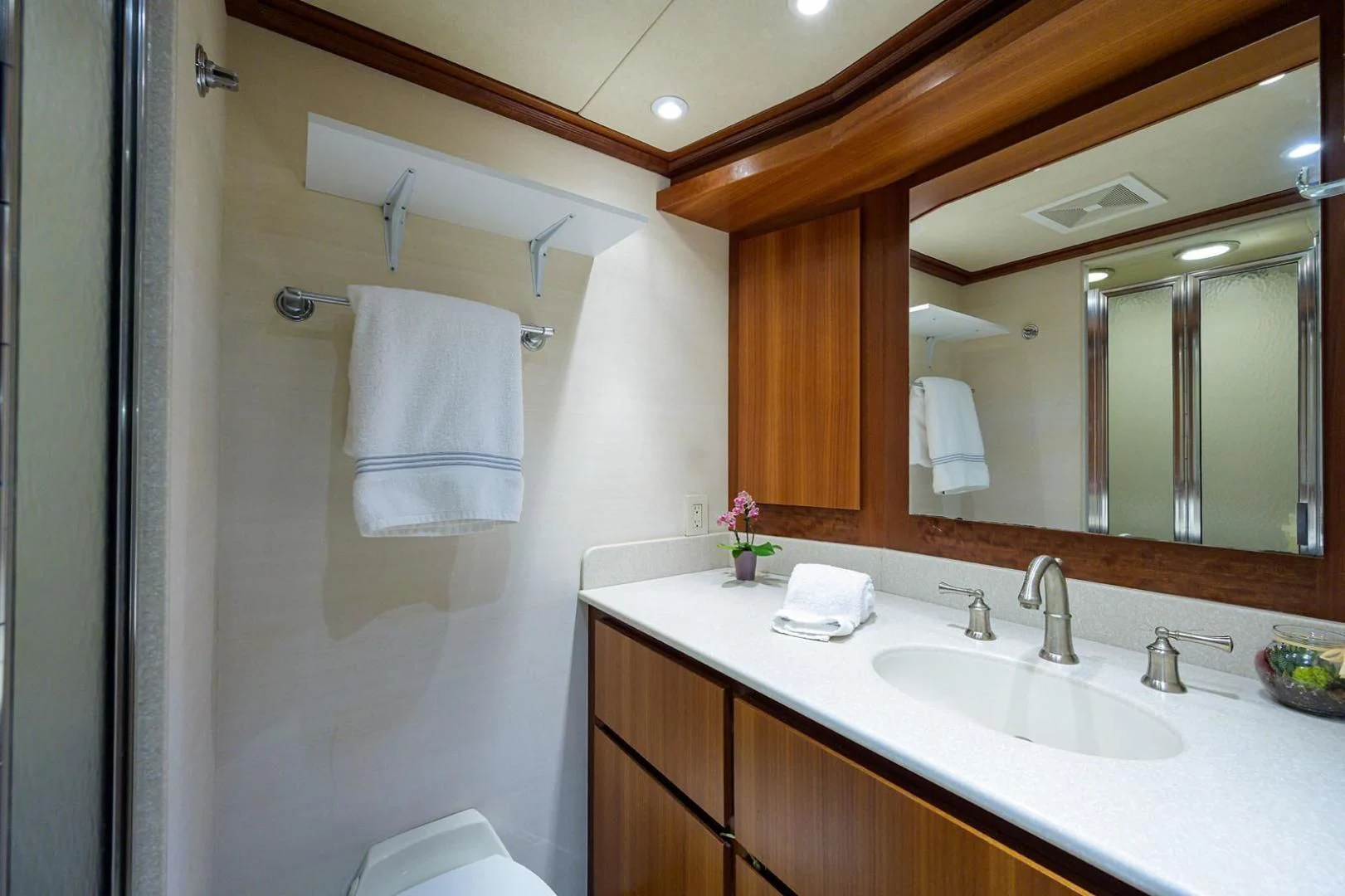 a bathroom with a large mirror aboard LEGACY Yacht for Sale