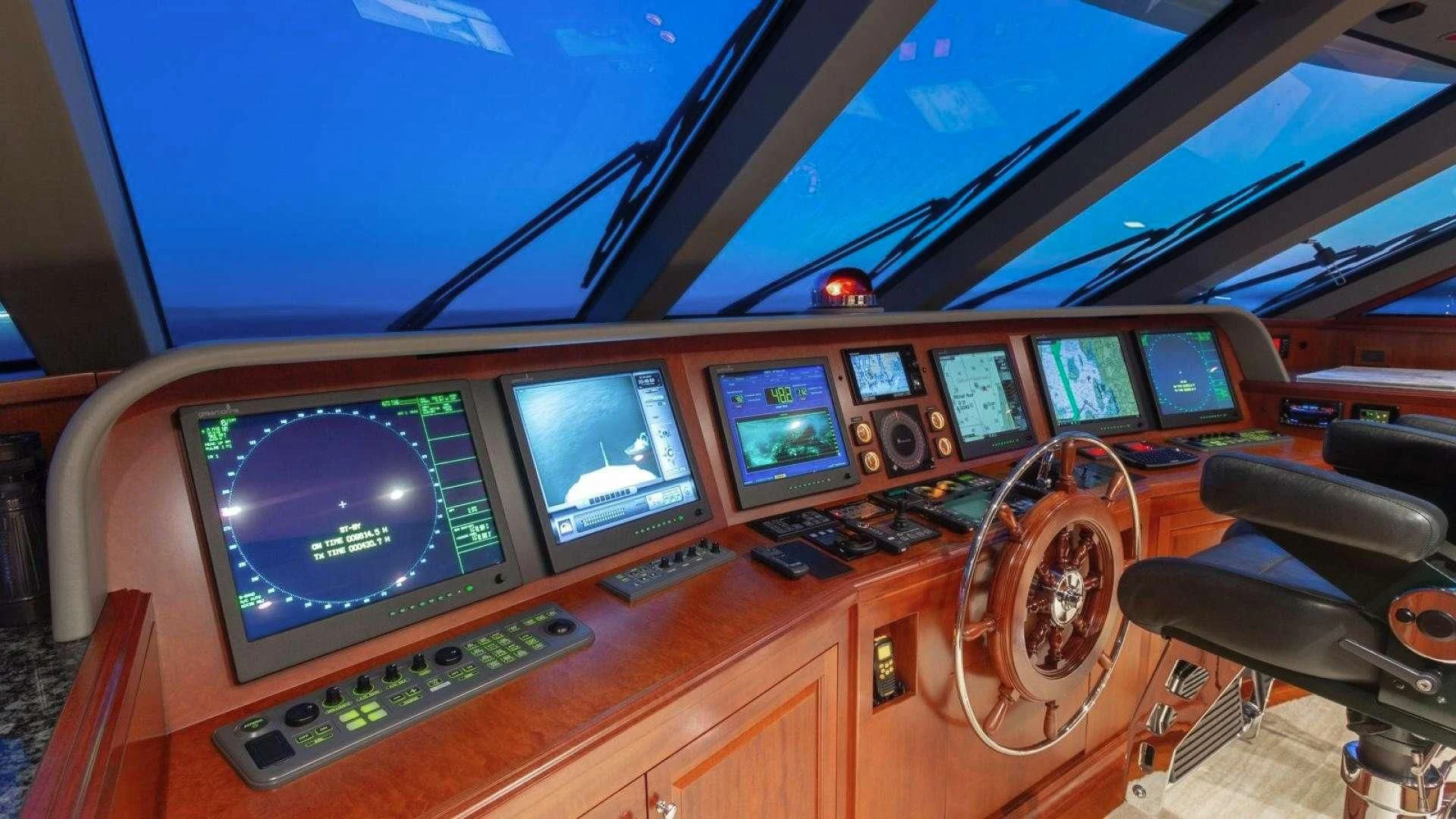 a control panel with many monitors aboard LEGACY Yacht for Sale