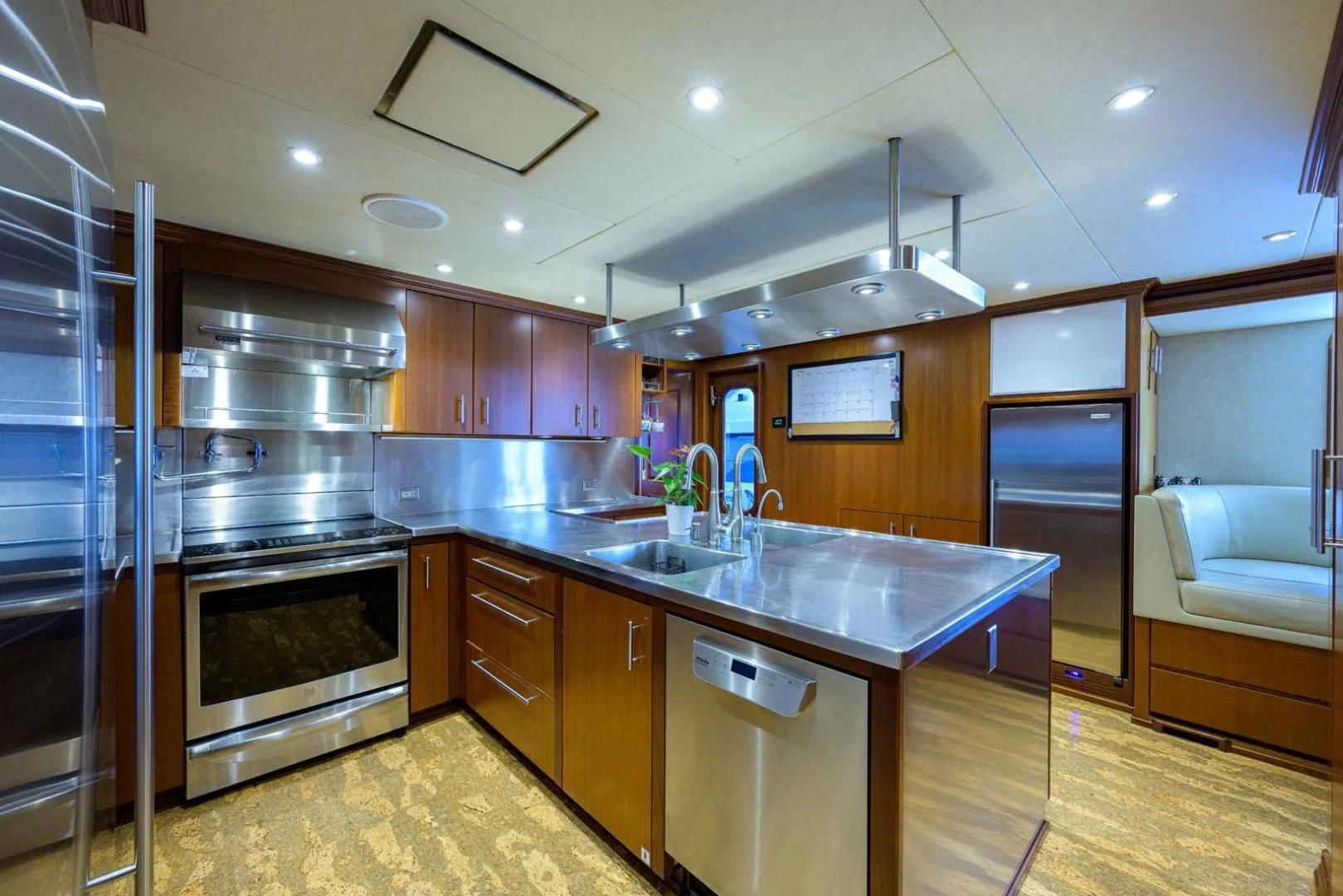 a kitchen with a stainless steel oven aboard LEGACY Yacht for Sale