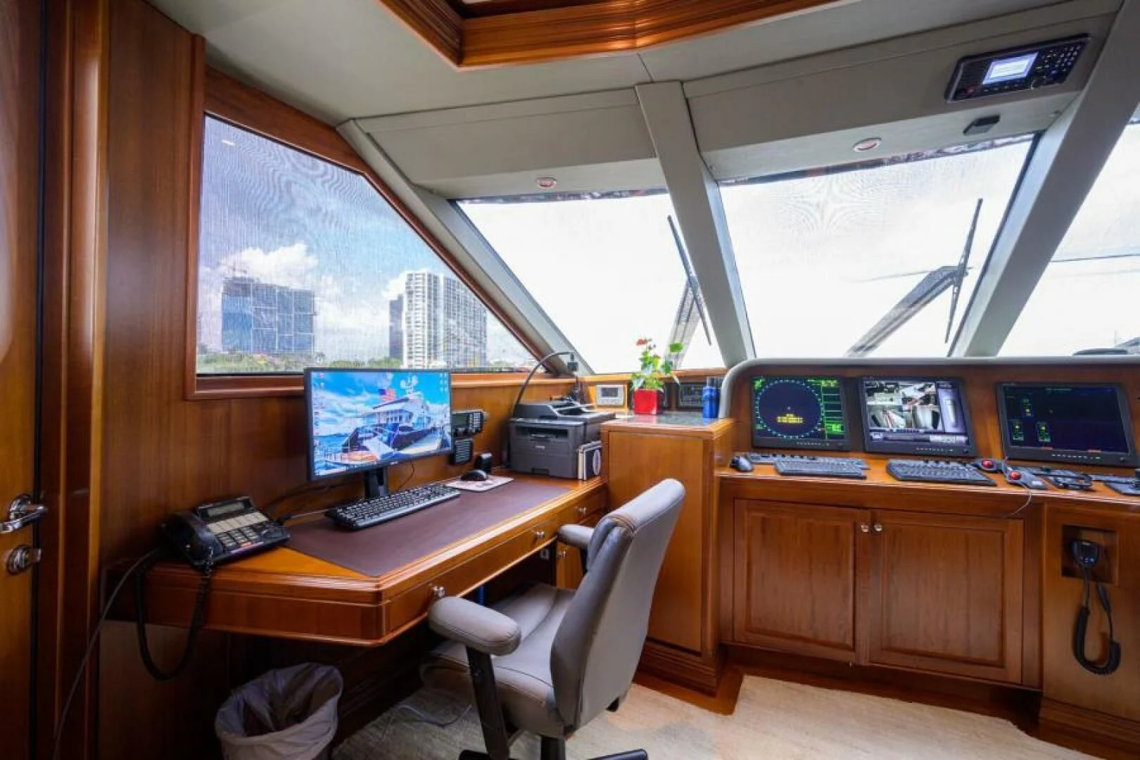 a room with computers and monitors aboard LEGACY Yacht for Sale