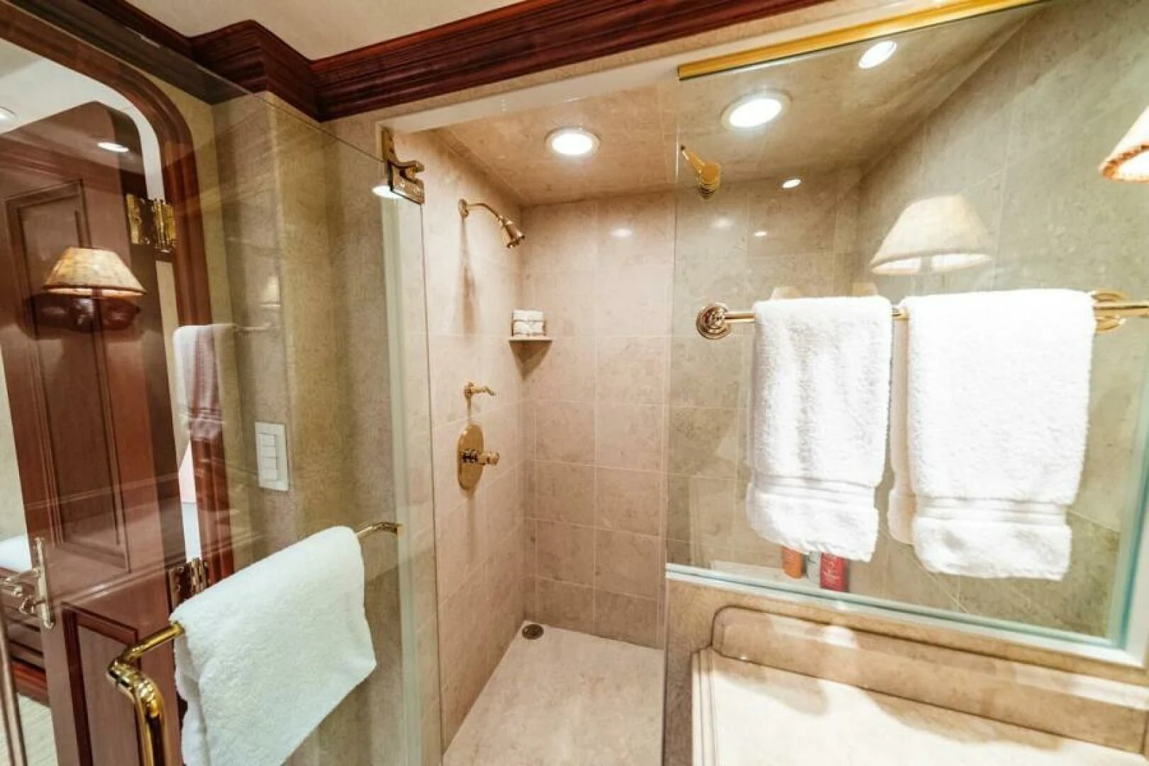 a bathroom with a large mirror aboard LEGACY Yacht for Sale