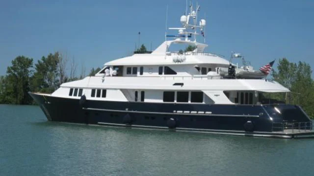 a large boat on the water aboard LEGACY Yacht for Sale