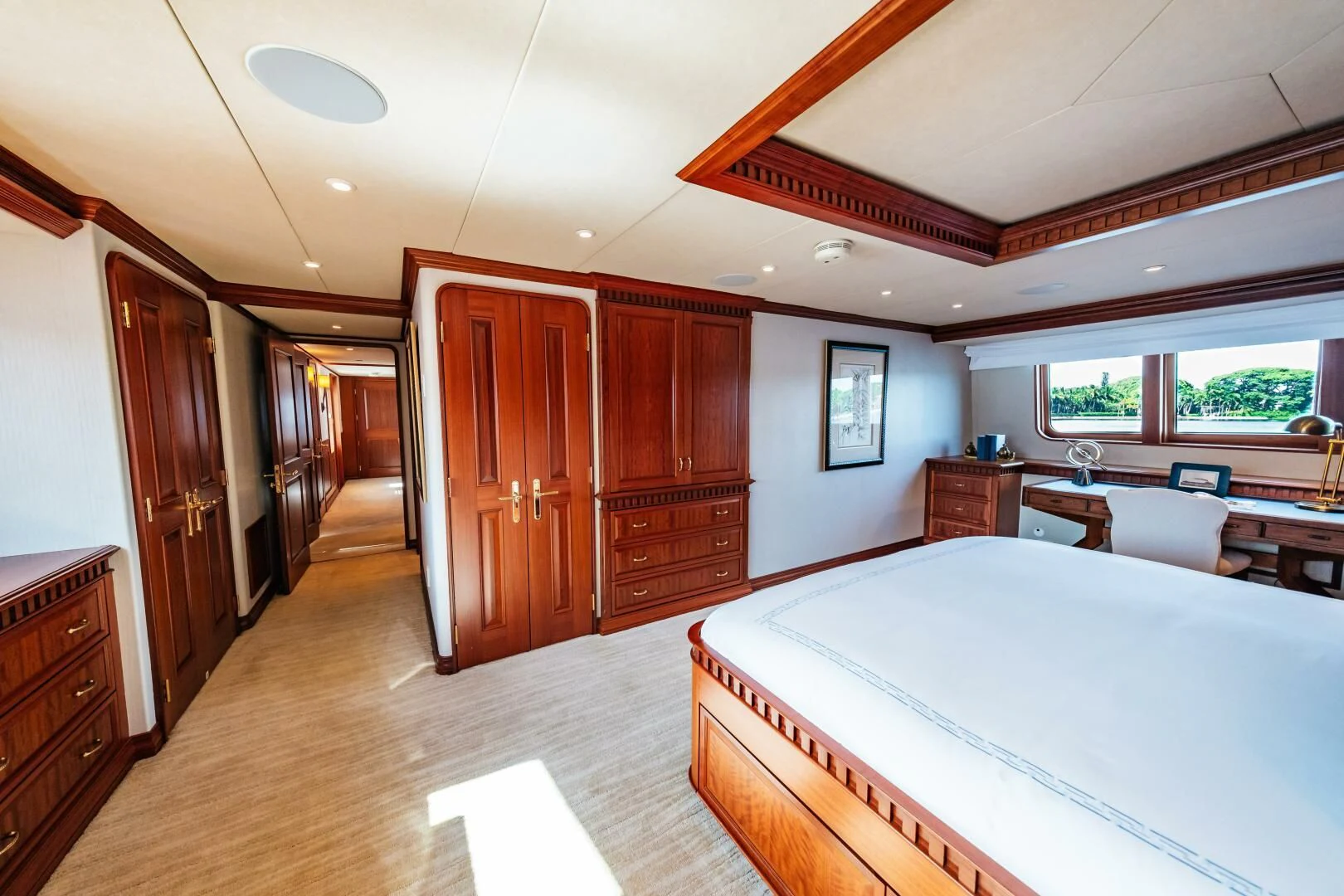 a bedroom with a bed and a closet aboard LEGACY Yacht for Sale