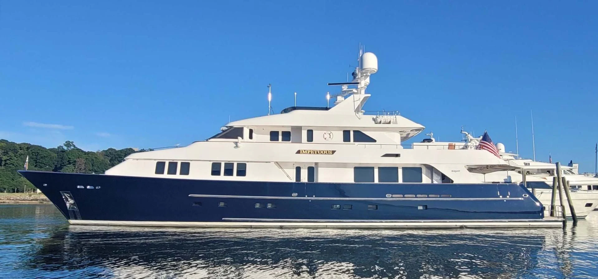 a large white boat aboard LEGACY Yacht for Sale