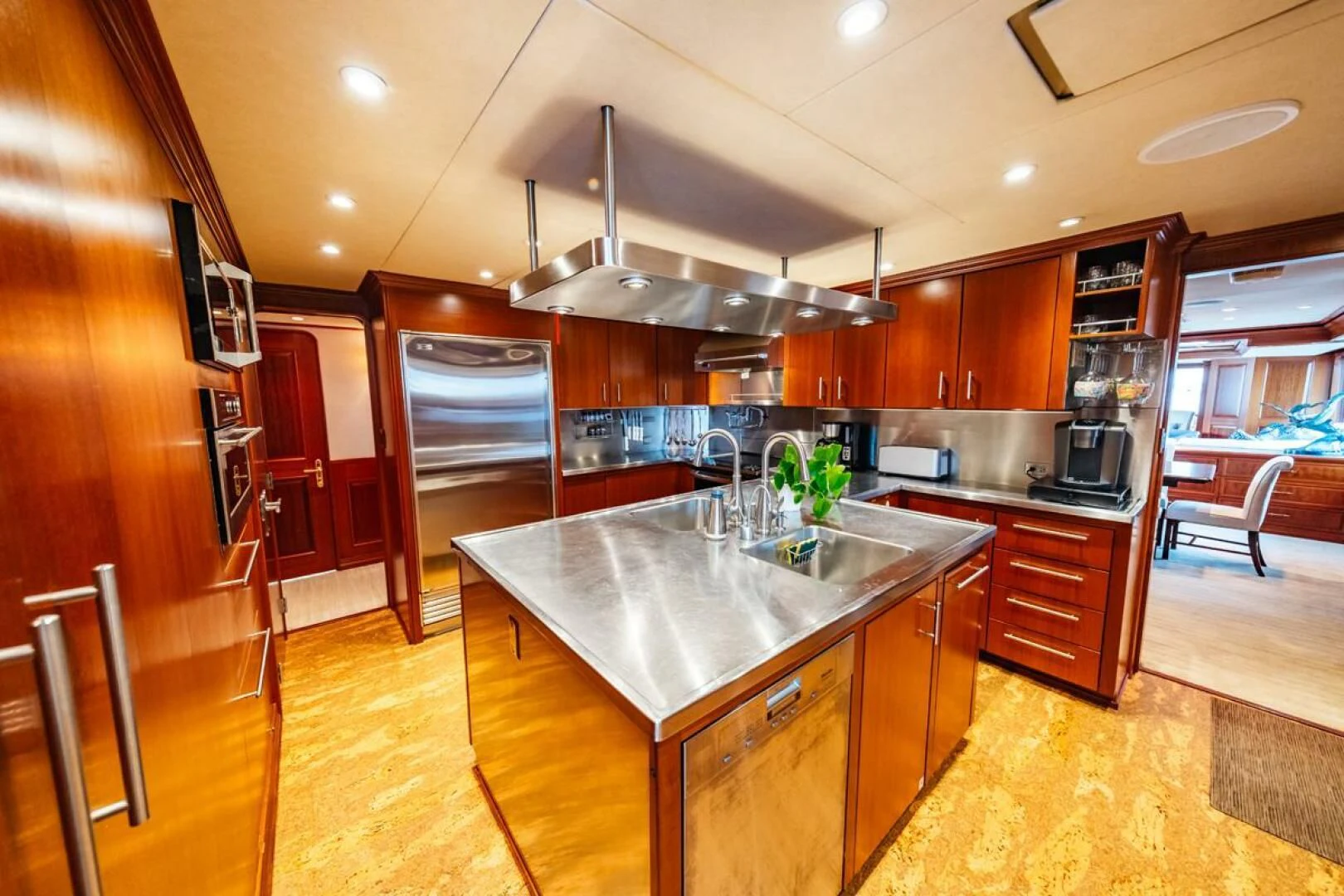 a kitchen with a large island aboard LEGACY Yacht for Sale