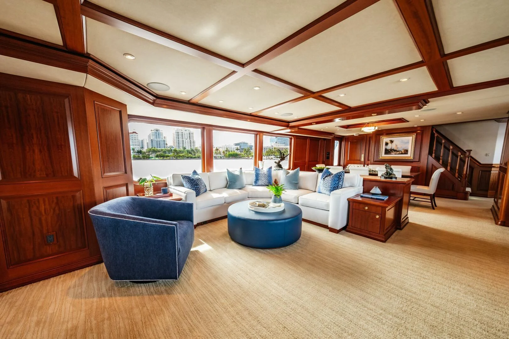 a living room with a wood floor aboard LEGACY Yacht for Sale