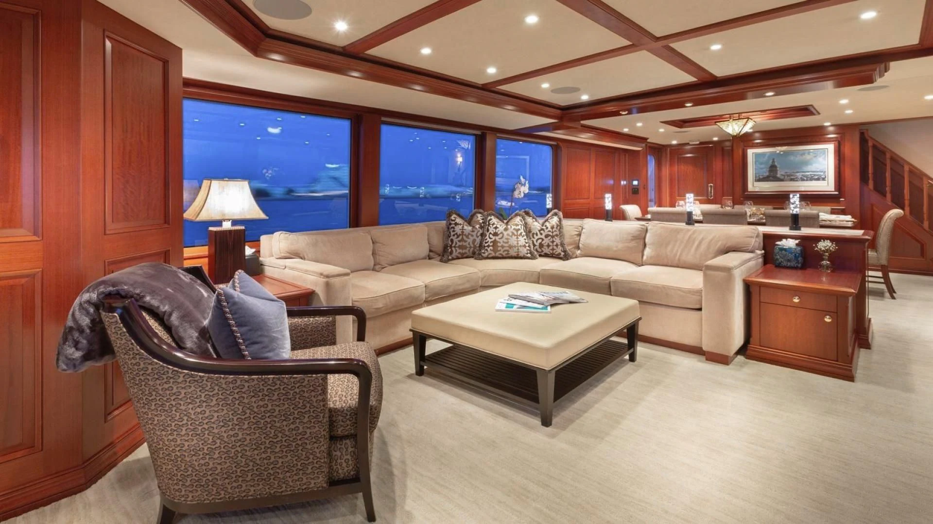 a living room with a couch and a coffee table aboard LEGACY Yacht for Sale