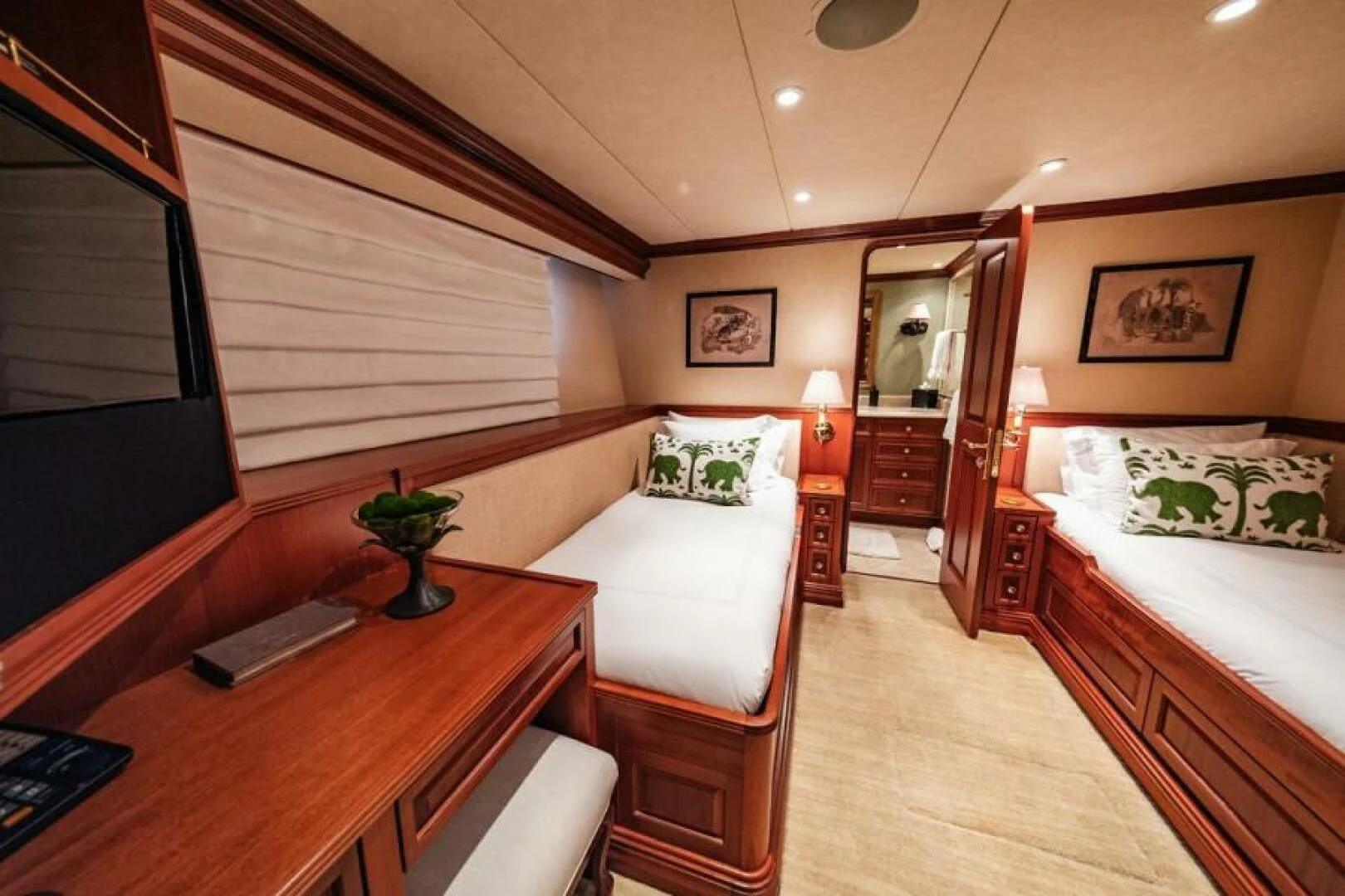 a room with a bed and a desk aboard LEGACY Yacht for Sale