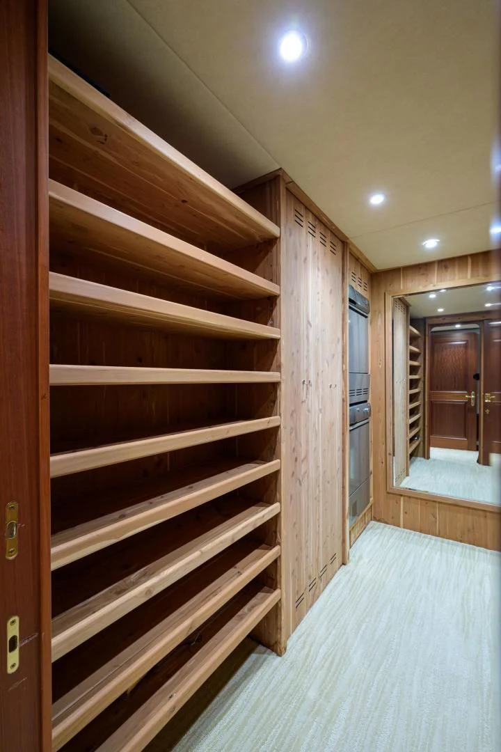 a wood closet in a room aboard LEGACY Yacht for Sale